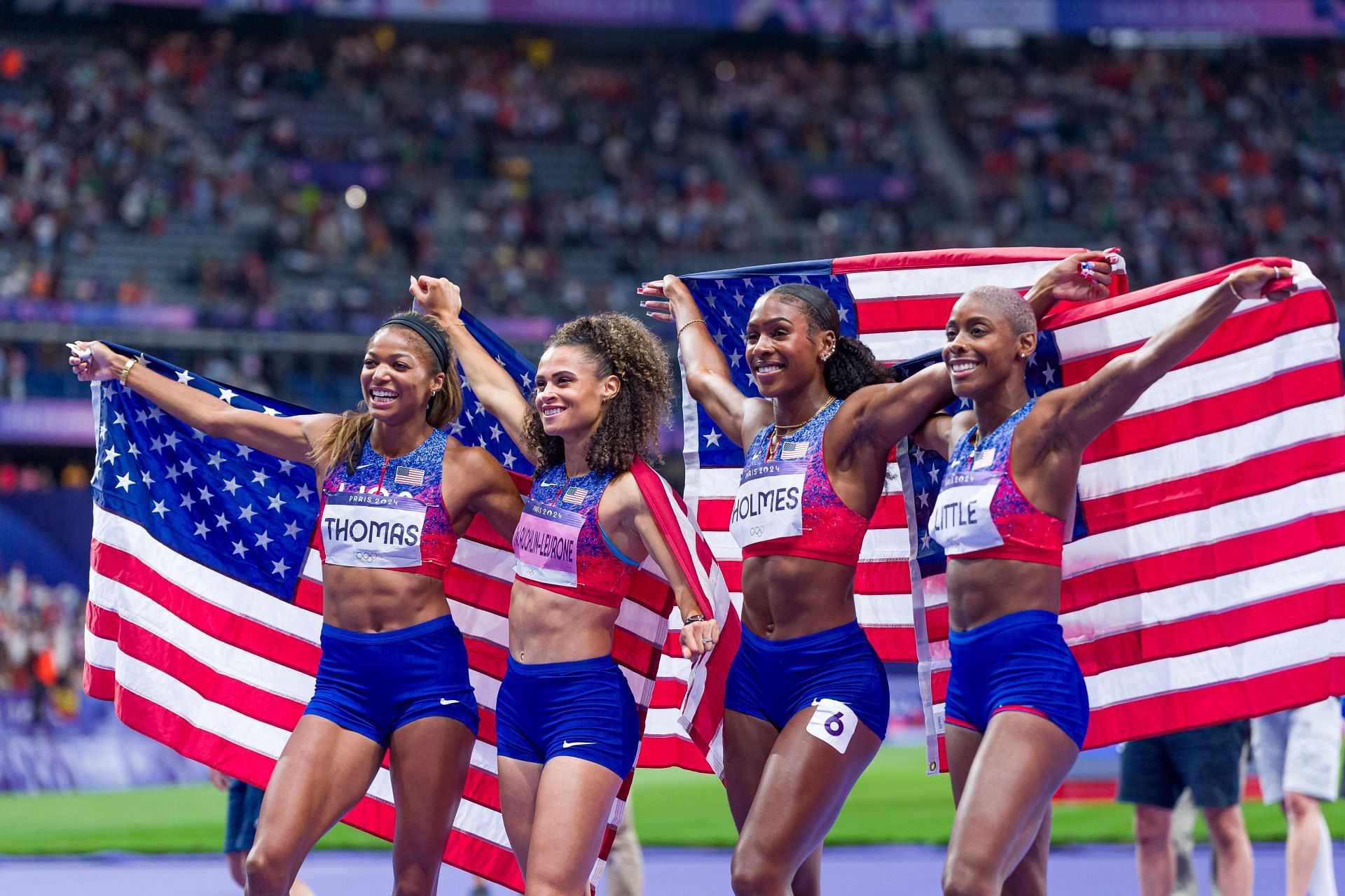 Gabrielle Thomas, Sydney McLaughlin-Levrone, Alexis Holmes, and Shamier Little celebrate winning the Gold medal in the Women&#039;s 4 x 400m Relay Final at the Paris Olympics 2024. (Photo via Getty Images)