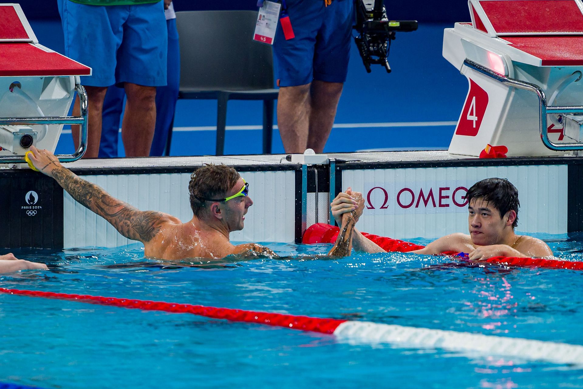 Kyle Chambers [L] congratulating Pan Zhanle after his win in men&#039;s 100m freestyle at the Paris Olympics 2024