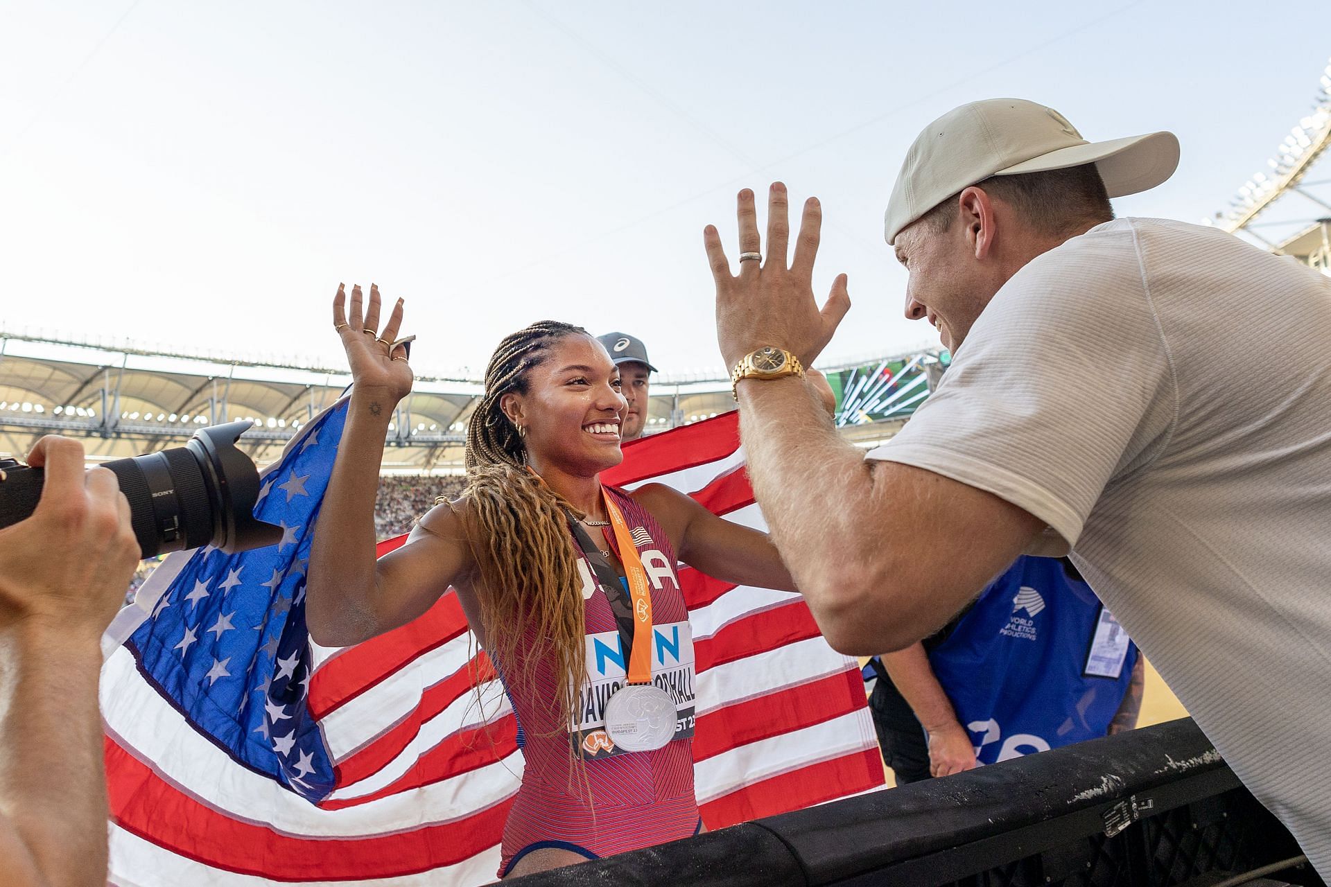 Tara Davis-Woodhall celebrates her silver medal win with her husband Hunter Woodhall after the Women&#039;s Long Jump Final during the World Athletics Championships 2023 in Budapest, Hungary. (Photo via Getty Images)