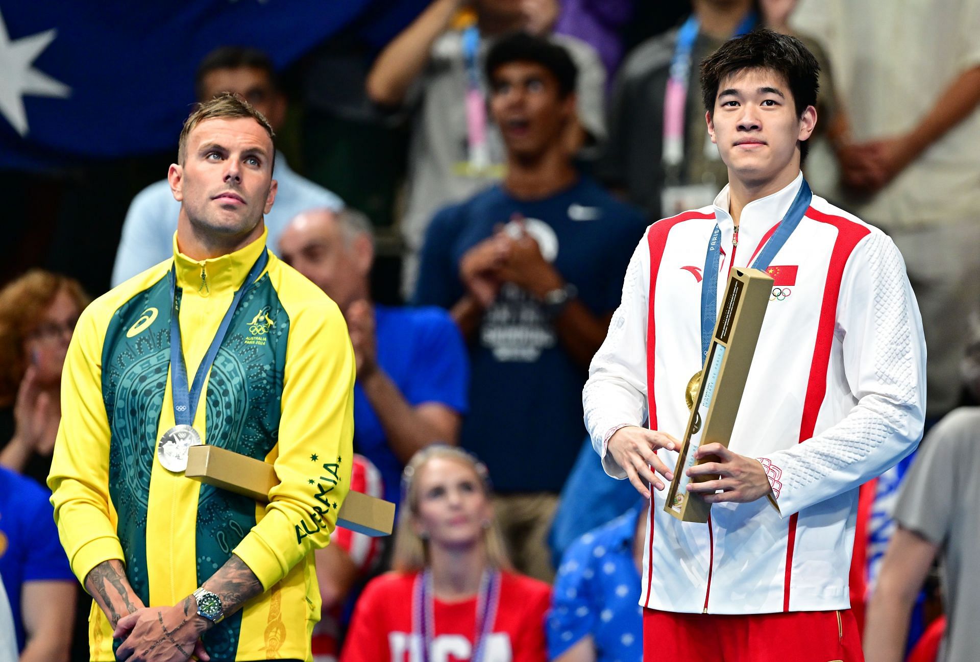 Zhanle Pan and Kyle Chalmers pose during the Swimming medal ceremony at the Olympic Games 2024 in Paris, France (Photo via Getty Images)