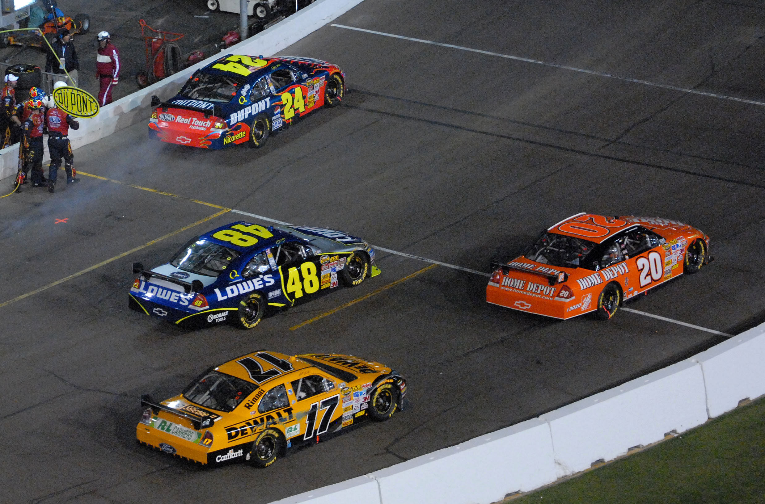 Jeff Gordon (24) Jimmie Johnson (48) Tony Stewart (20) and Matt Kenseth (17) race off pit road during the Subway Fresh Fit 500 at Phoenix International Raceway. Mandatory Credit: Mark J. Rebilas-USA TODAY Sports Copyright &copy; 2007 Mark J. Rebilas. Source: Imagn