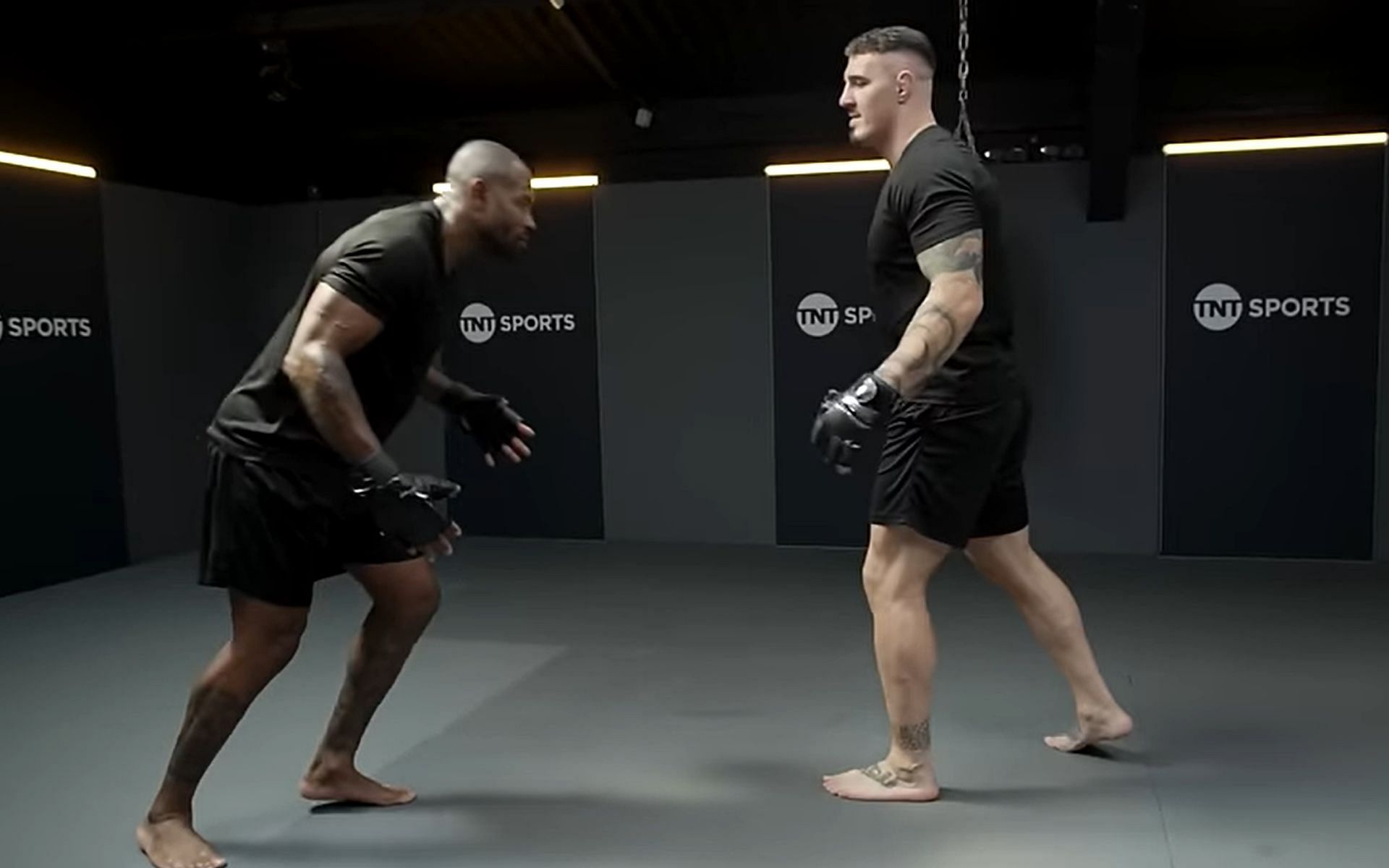 Ugo Monye (left) tried his hand at grappling against Tom Aspinall (right). [Image courtesy: TNT Sports YouTube]