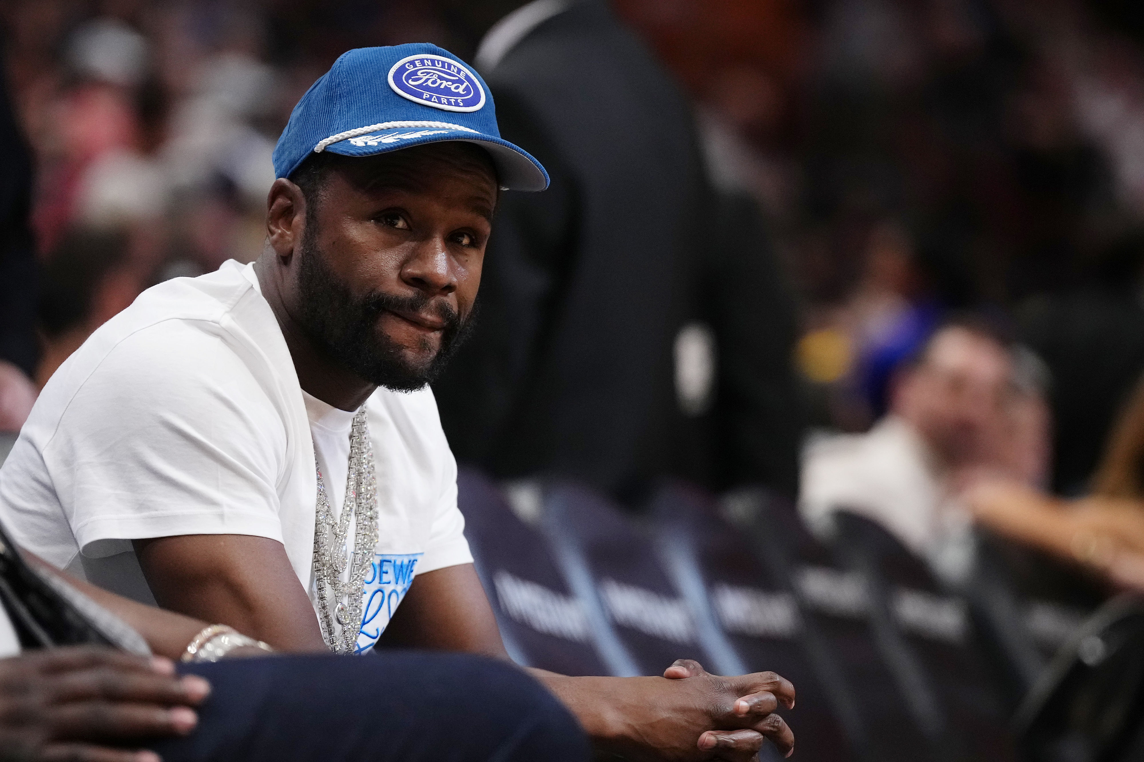 Former boxer Floyd Mayweather Jr. sits courtside during the second half between the Miami Heat and the Los Angeles Lakers at Kaseya Center. Photo Credit: Imagn