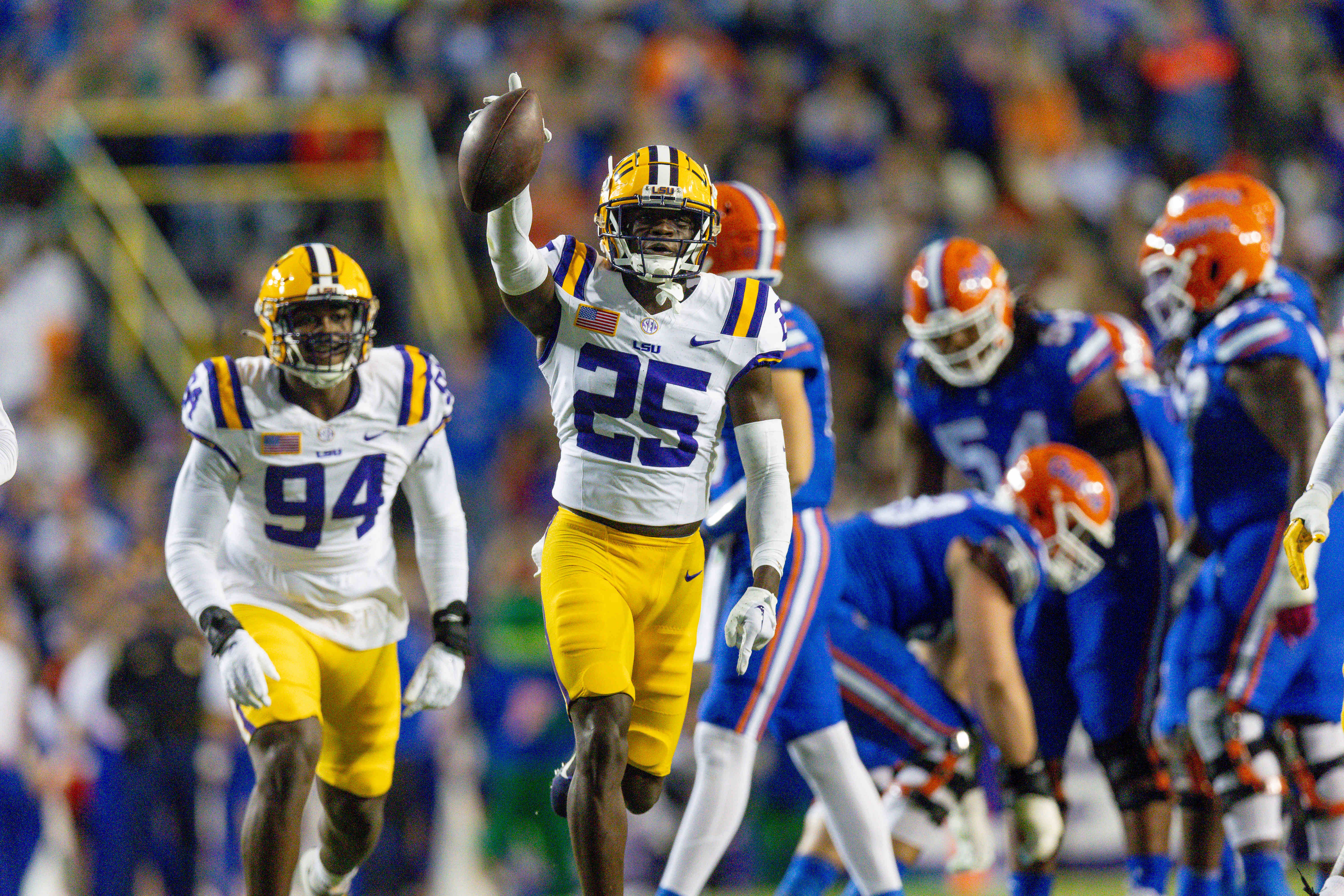 NCAA Football: Florida at Louisiana State - Source: Imagn: Nov 11, 2023; Baton Rouge, Louisiana, USA; LSU Tigers safety Javien Toviano (25) recovers a fumble against the Florida Gators during the first half at Tiger Stadium. Mandatory Credit: Stephen Lew-USA TODAY Sports