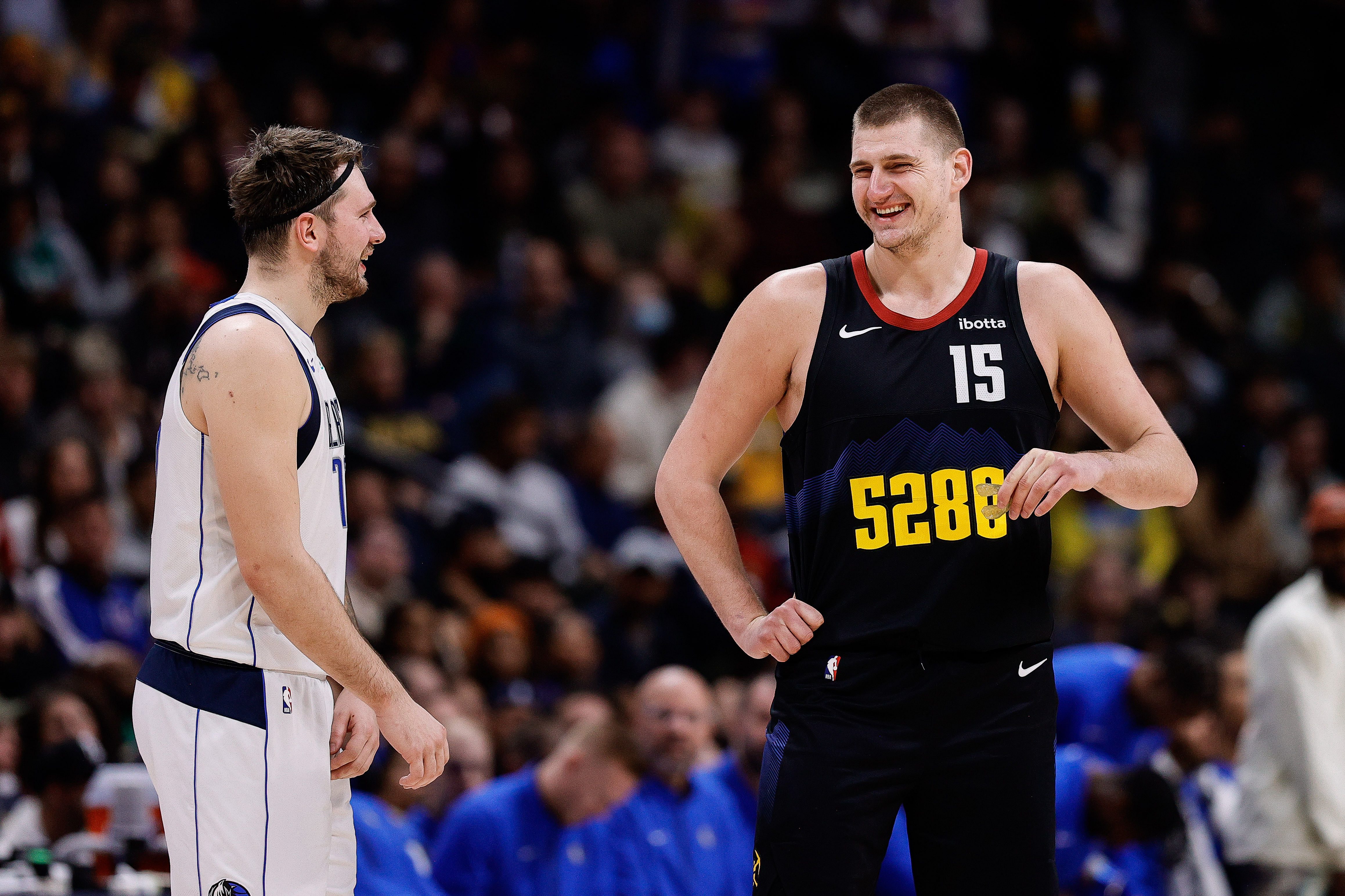 Dallas Mavericks guard Luka Doncic and Denver Nuggets center Nikola Jokic (15) in the second quarter at Ball Arena. Mandatory Credit: Isaiah J. Downing-USA TODAY Sports