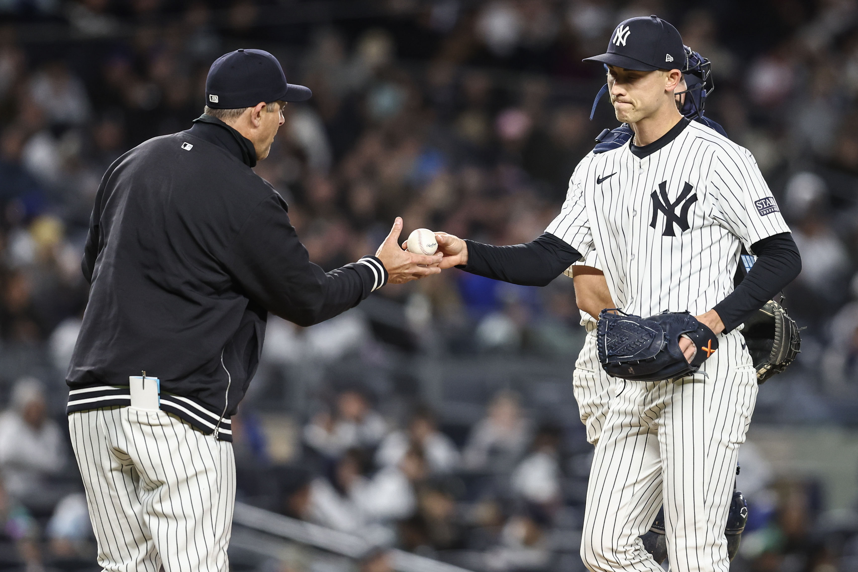 New York Yankees - Aaron Boone and Luke Weaver (Photo via IMAGN)