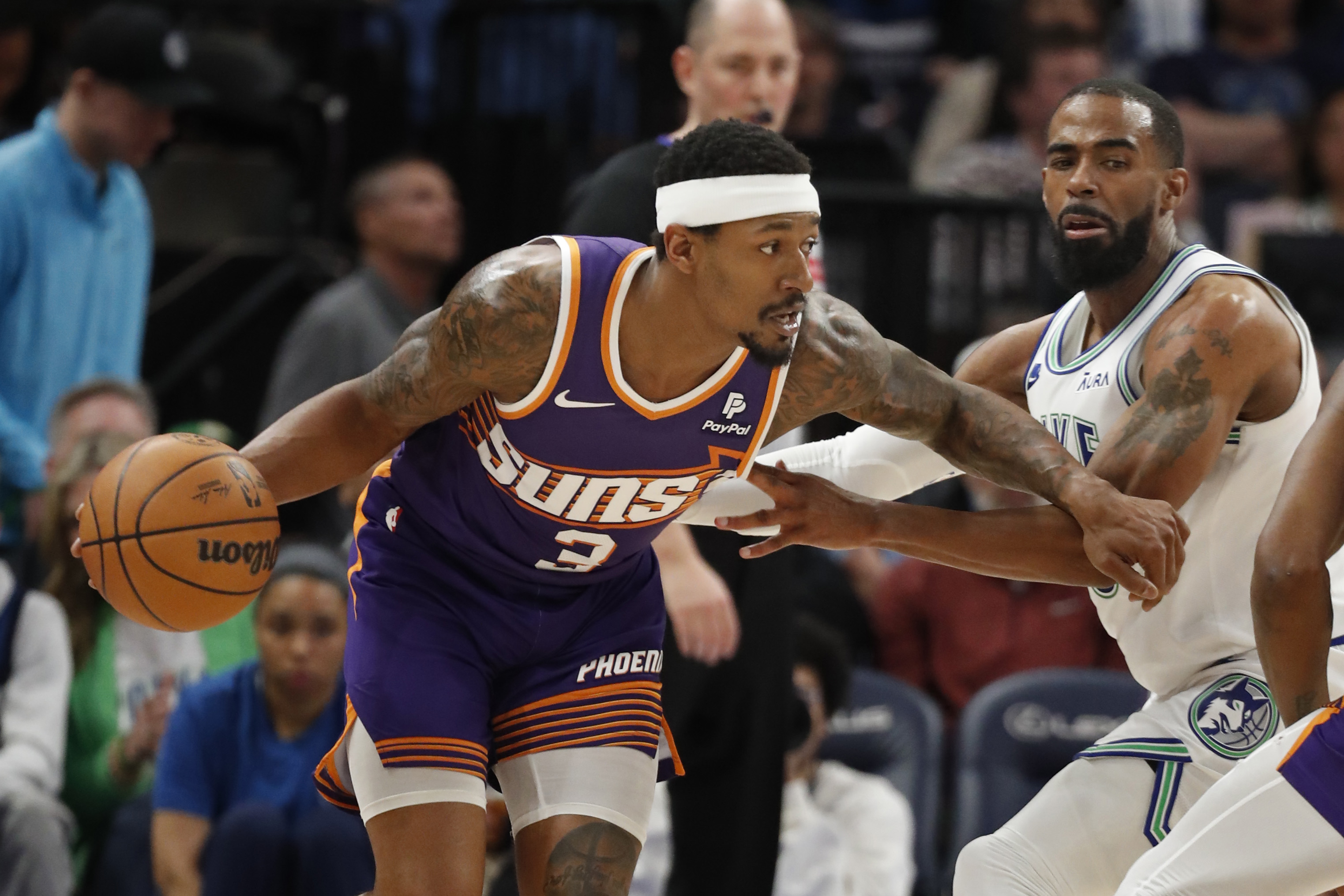 Phoenix Suns guard Bradley Beal works around Minnesota Timberwolves guard Mike Conley at Target Center. Photo Credit: Imagn