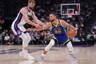 Golden State Warriors guard Stephen Curry dribbles the ball next to Sacramento Kings forward Domantas Sabonis at the Golden 1 Center. Photo Credit: Imagn