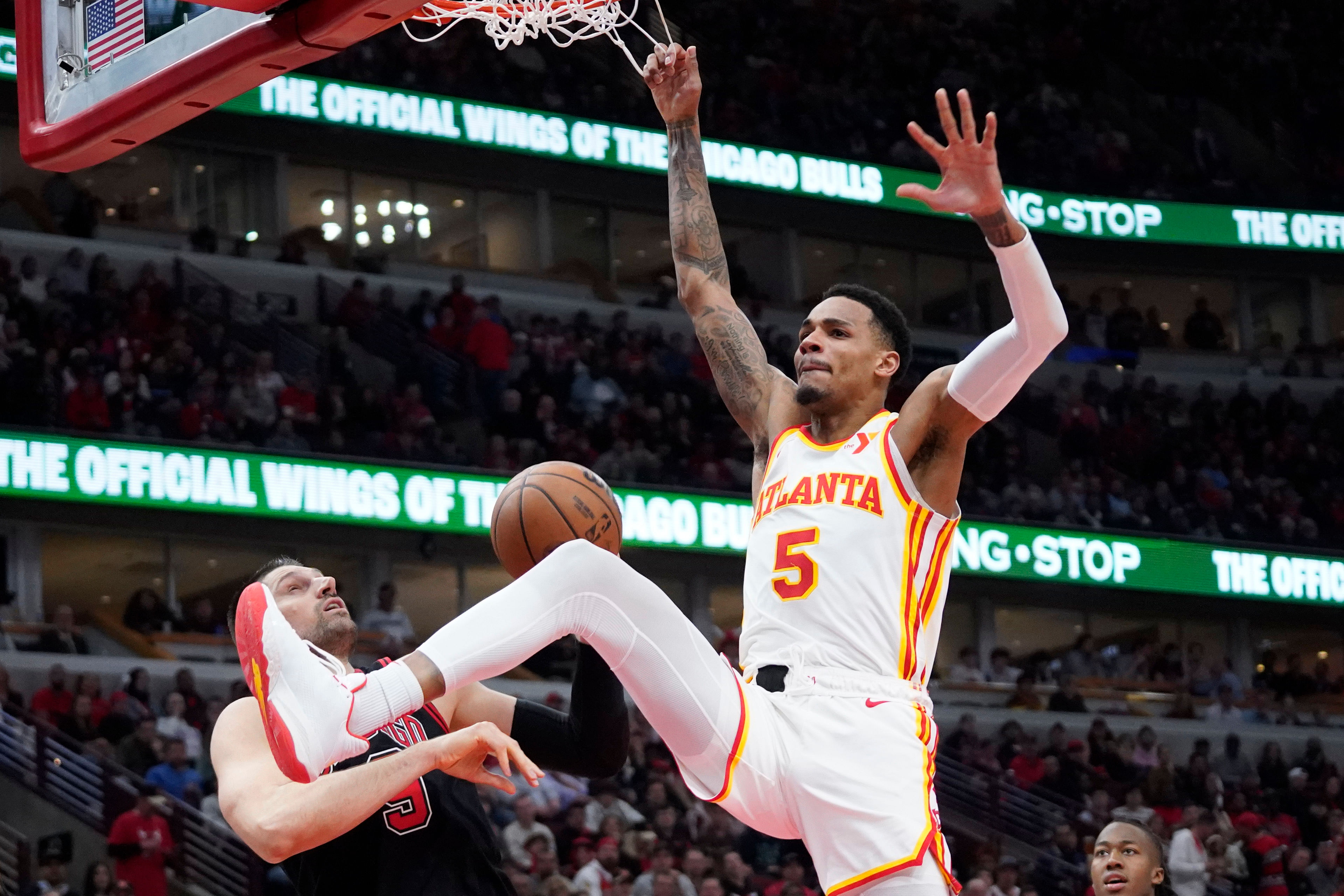 Guard Dejounte Murray dunks the ball against the Chicago Bulls at United Center. Photo Credit: Imagn