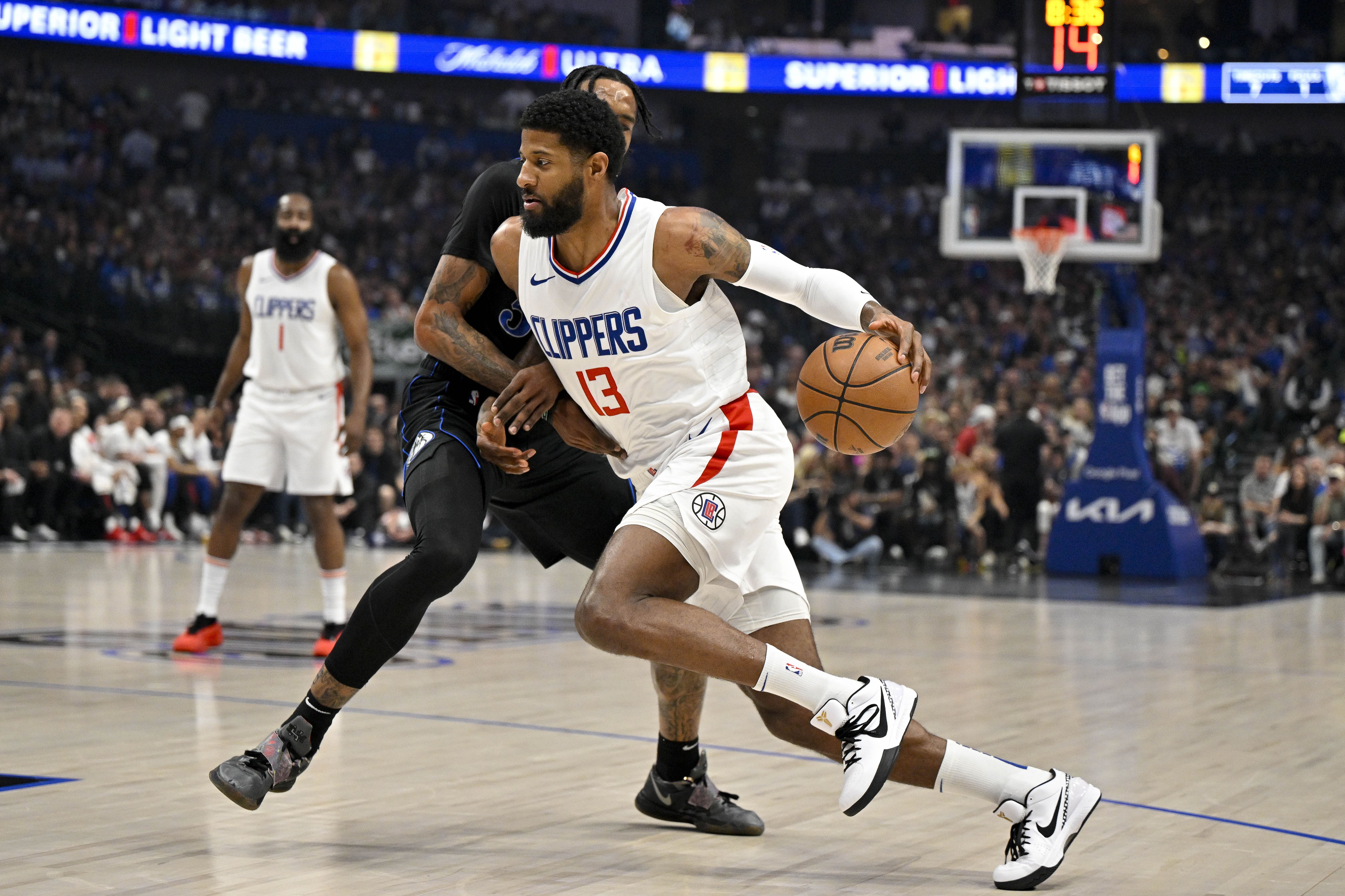 Paul George drives to the basket against the Dallas Mavericks during the 2024 NBA playoffs. Photo Credit: Imagn