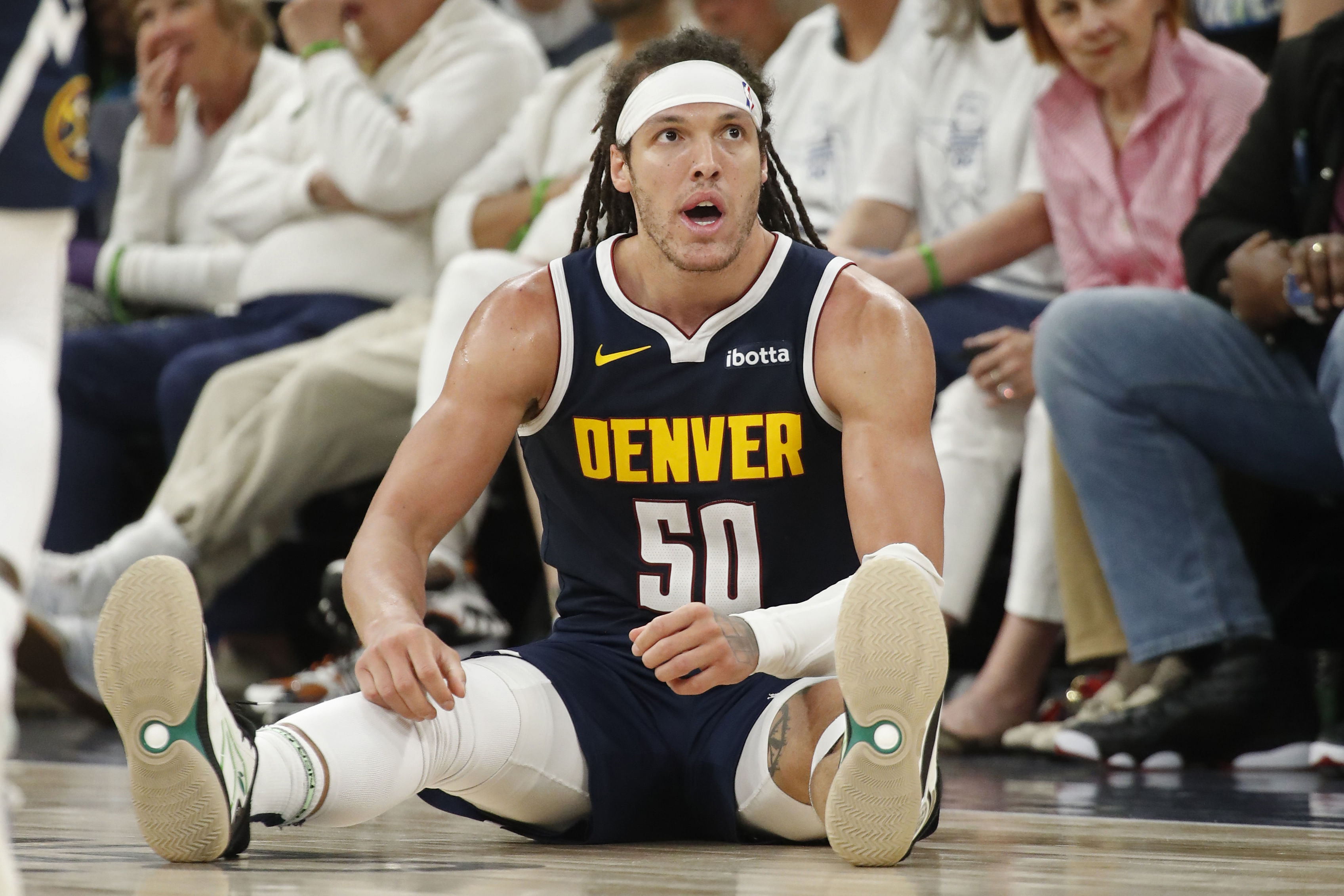 Denver Nuggets forward Aaron Gordon sits after drawing a foul from the Minnesota Timberwolves during a game at the Target Center. Photo Credit: Imagn