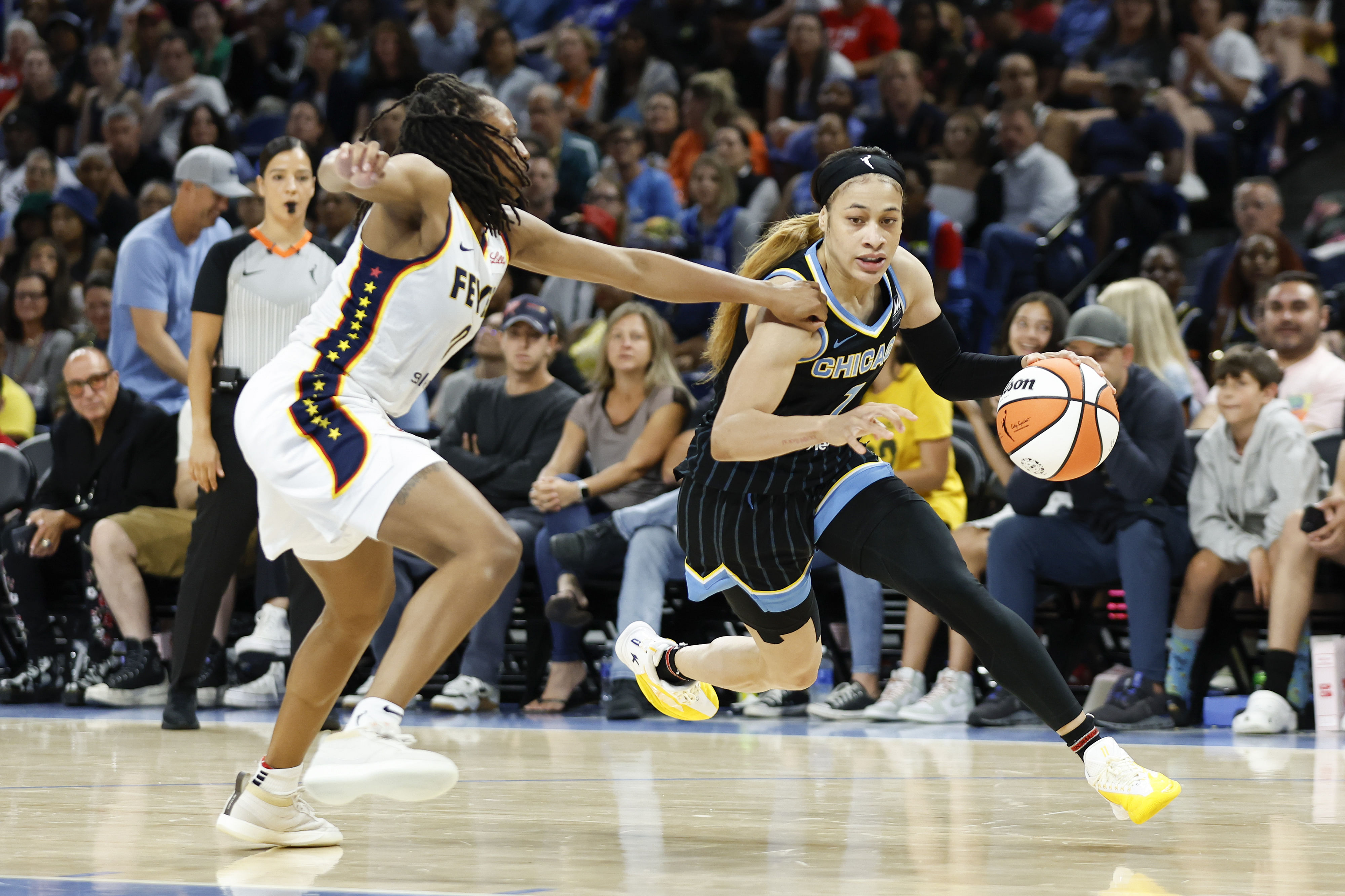 Chennedy Carter drives to the basket against Indiana Fever guard Kelsey Mitchell at Wintrust Arena. Photo Credit: Imagn