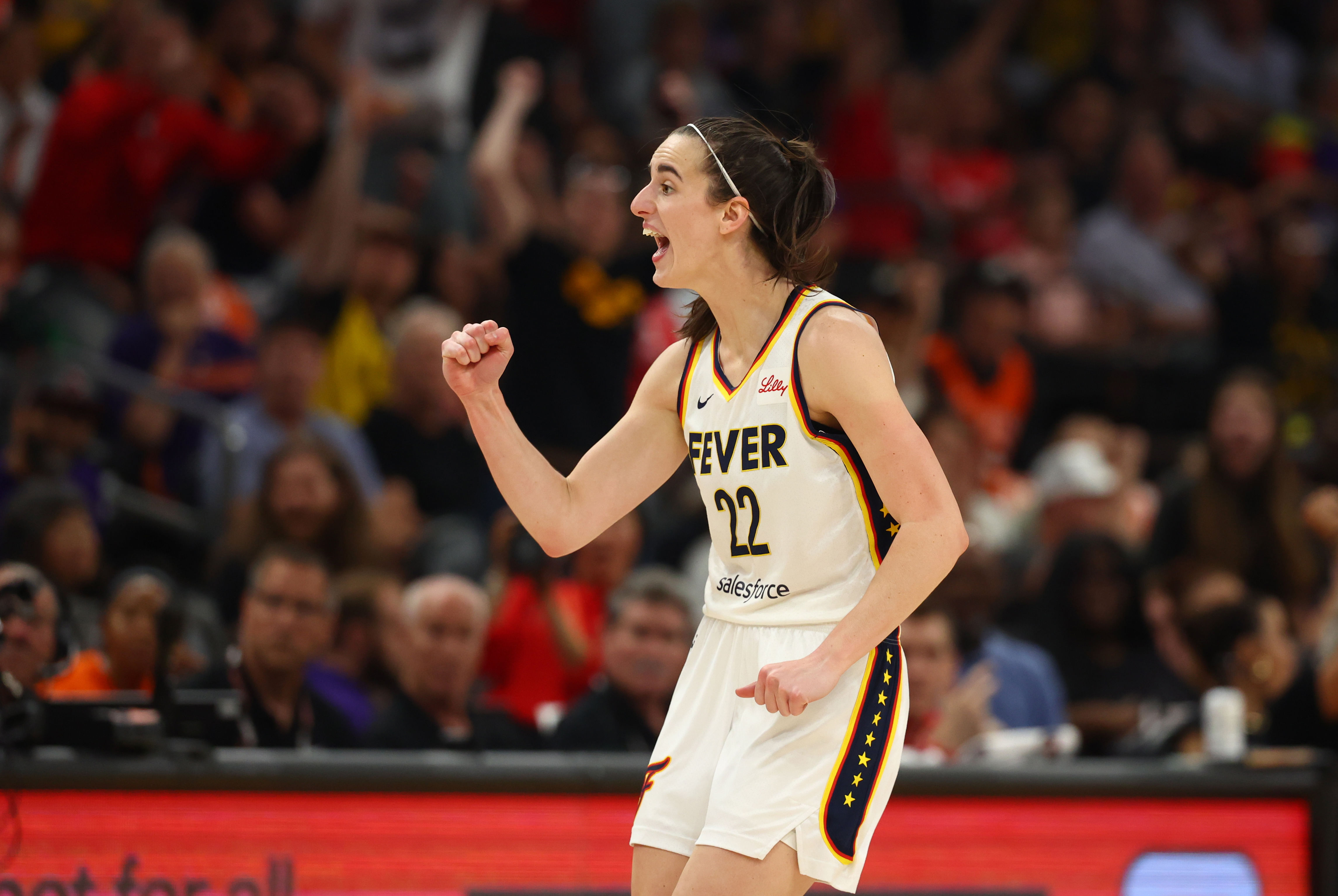 Indiana Fever guard Caitlin Clark celebrates against the Phoenix Mercury during a WNBA game at Footprint Center. Photo Credit: Imagn