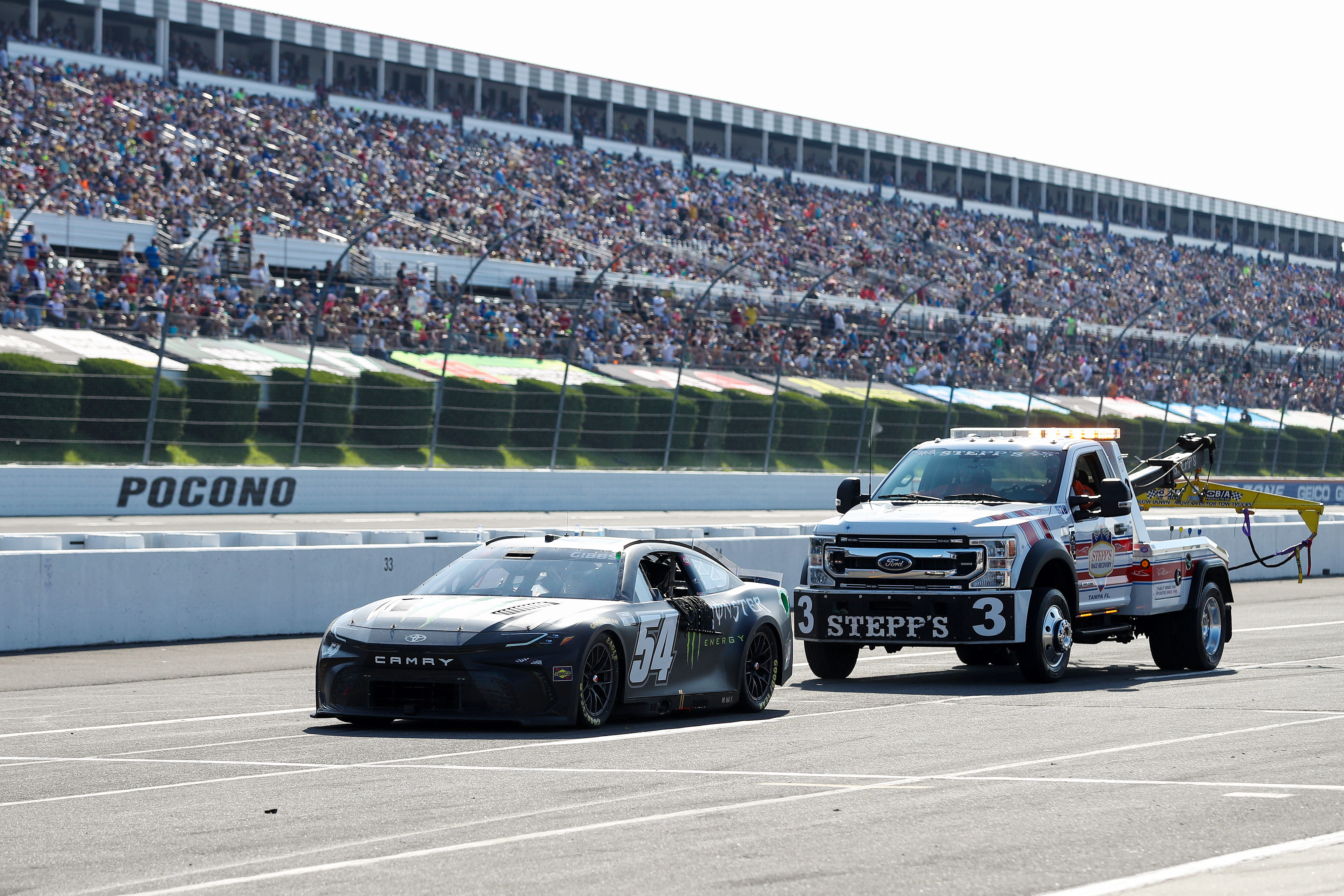 Ty Gibbs (54) is pushed on pit road after suffering an engine failure during The Great American Getaway 400 at Pocono Raceway (Image via Imagn)