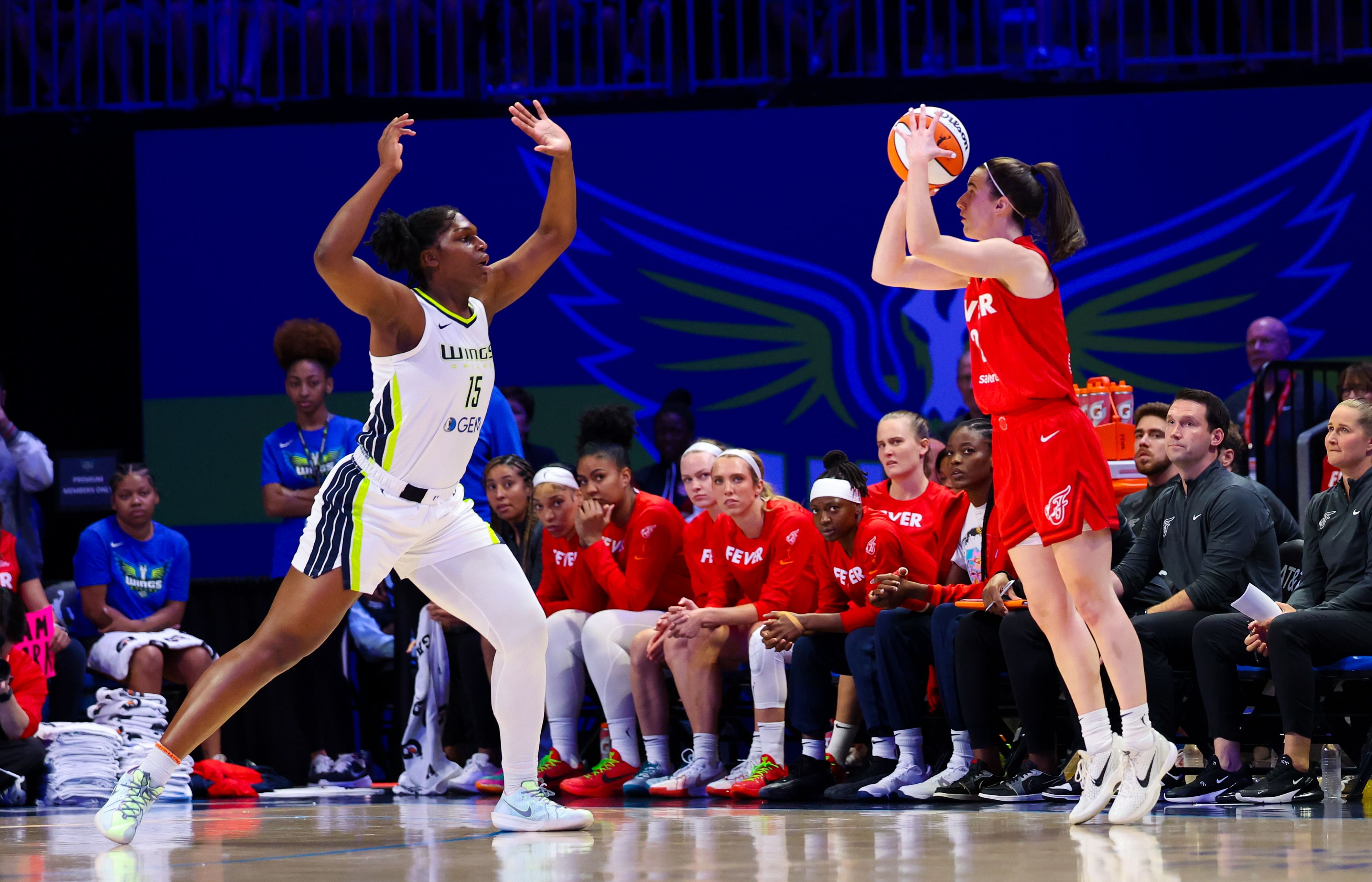 Indiana Fever guard Caitlin Clark shoots over Dallas Wings center Teaira McCowan during the first half at College Park Center. Photo Credit: Imagn