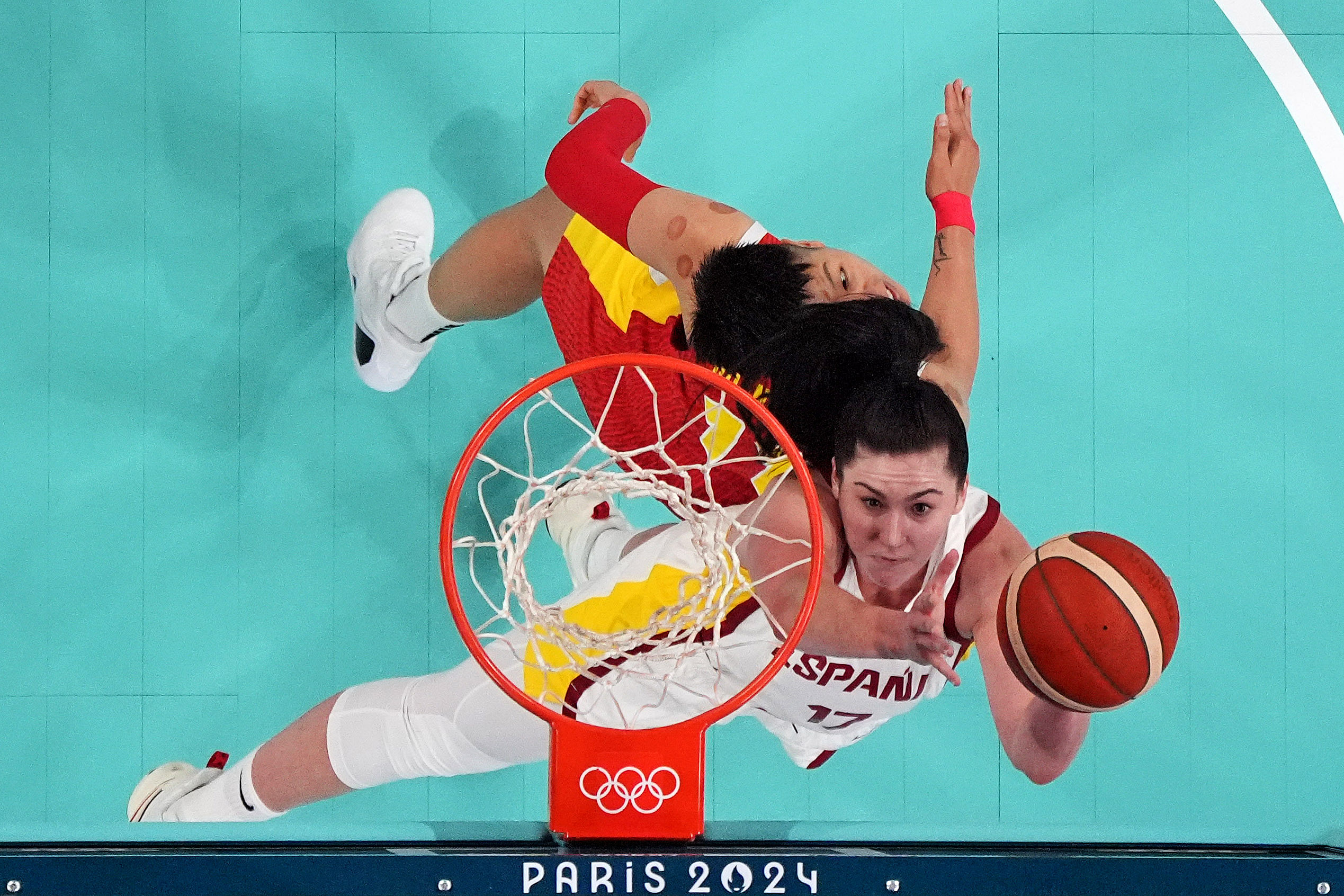 Spain centre Megan Gustafson shoots the ball against People&#039;s Republic of China power forward Sijing Huang at the Olympics women&#039;s basketball event. Credit: Imagn