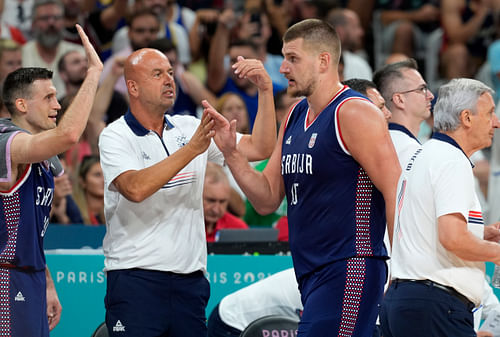 Serbia's Nikola Jokic celebrates with coaches and teammates after a play against Puerto Rico during the Paris Olympics basketball event at Stade Pierre-Mauroy (Photo Credit: Imagn)