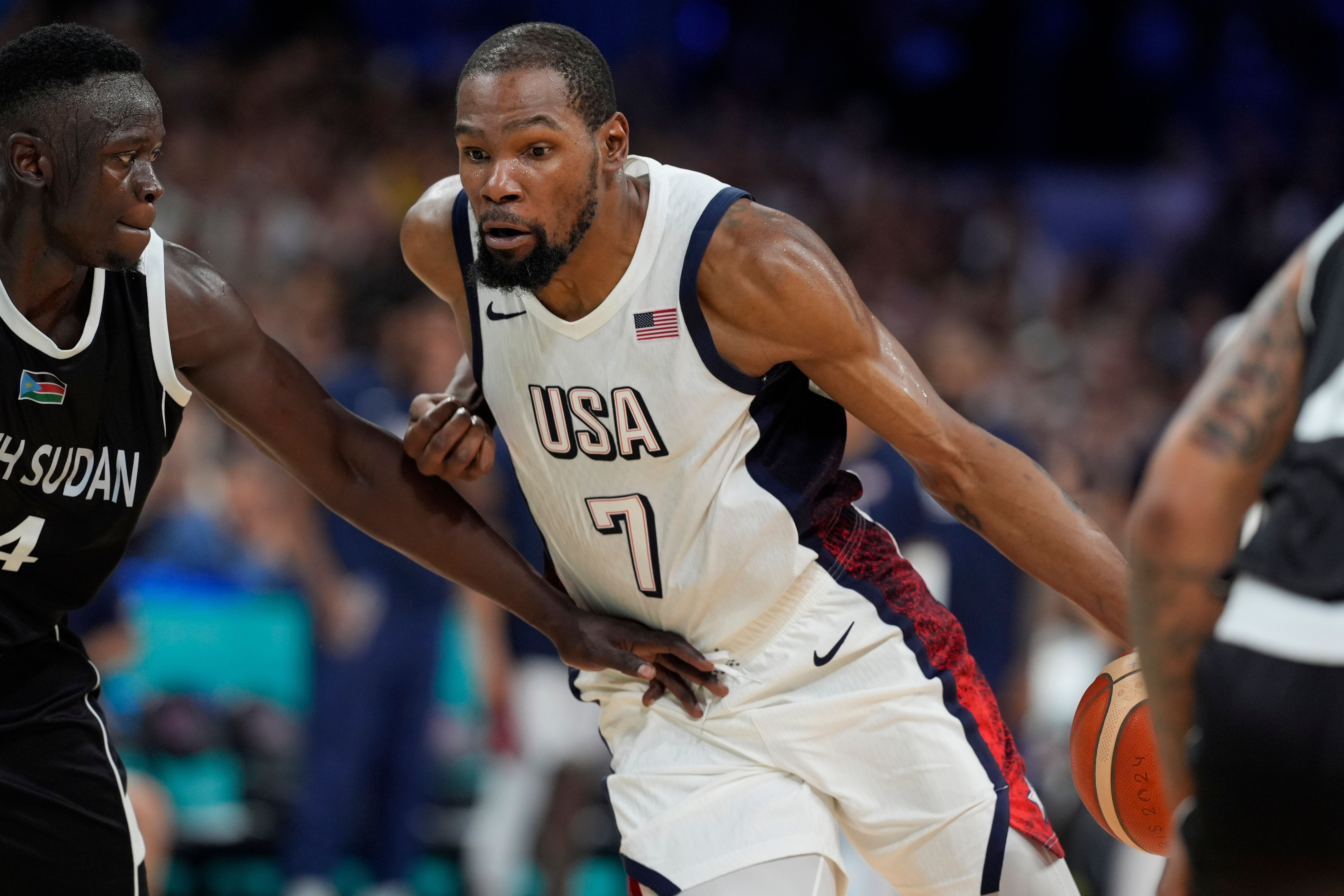 Kevin Durant dribbles against South Sudan at the Olympics basketball event at Stade Pierre-Mauroy. (image credit: Imagn)