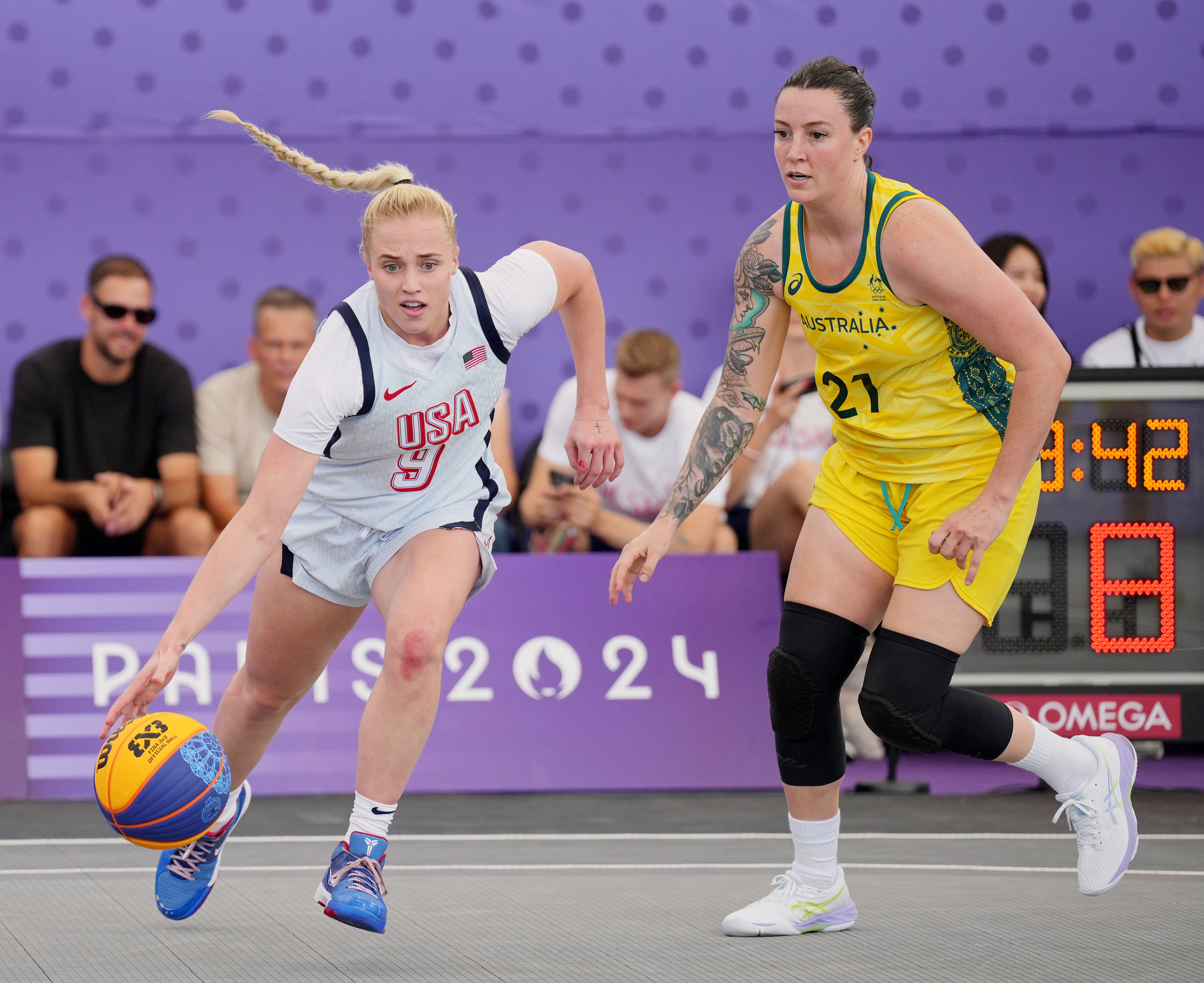 United States player Hailey van Lith (9) drives to the basket against Australia.