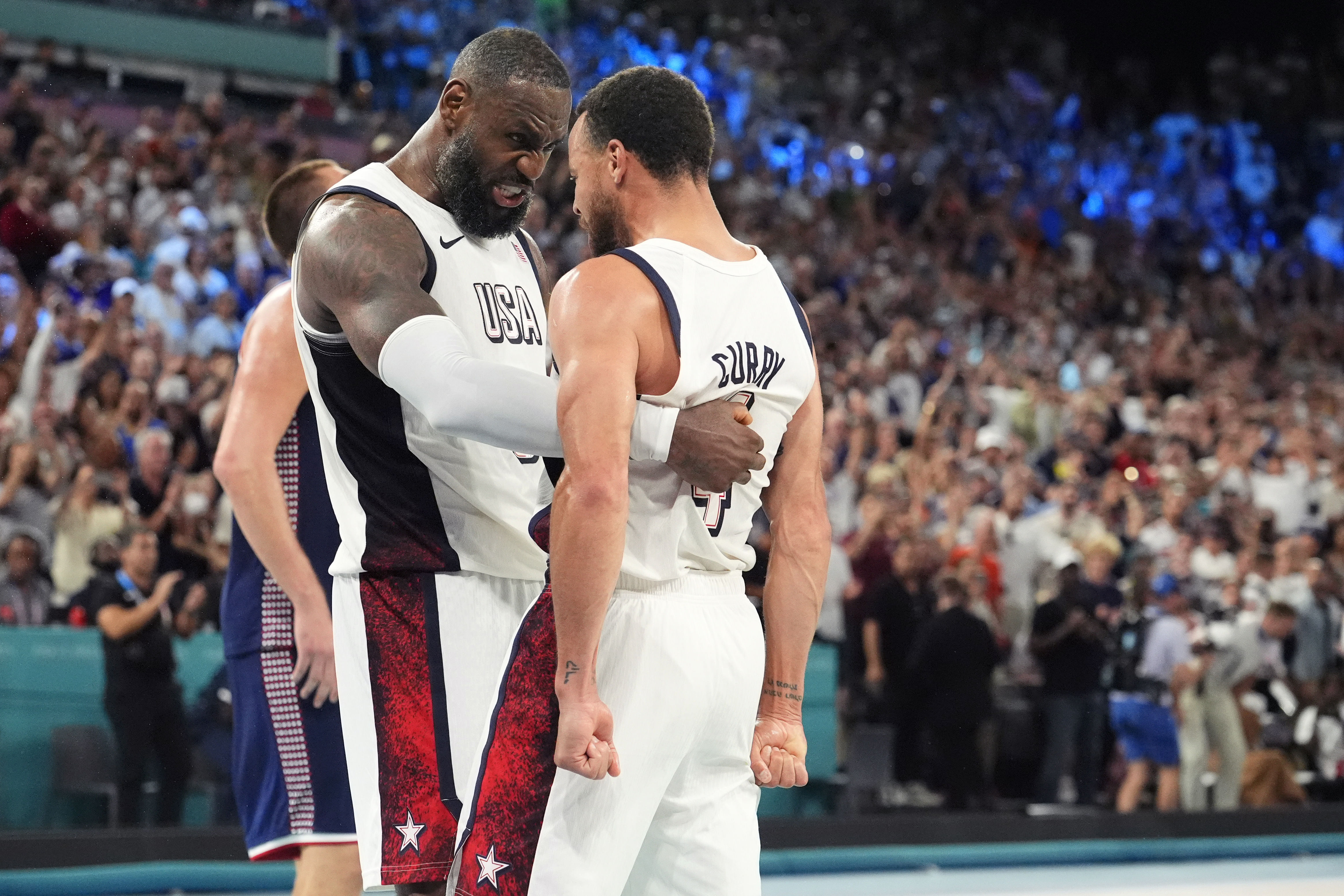 LeBron James and Stephen Curry celebrate after the game against Serbia at the Paris 2024 Olympic Summer Games. Photo Credit: Imagn