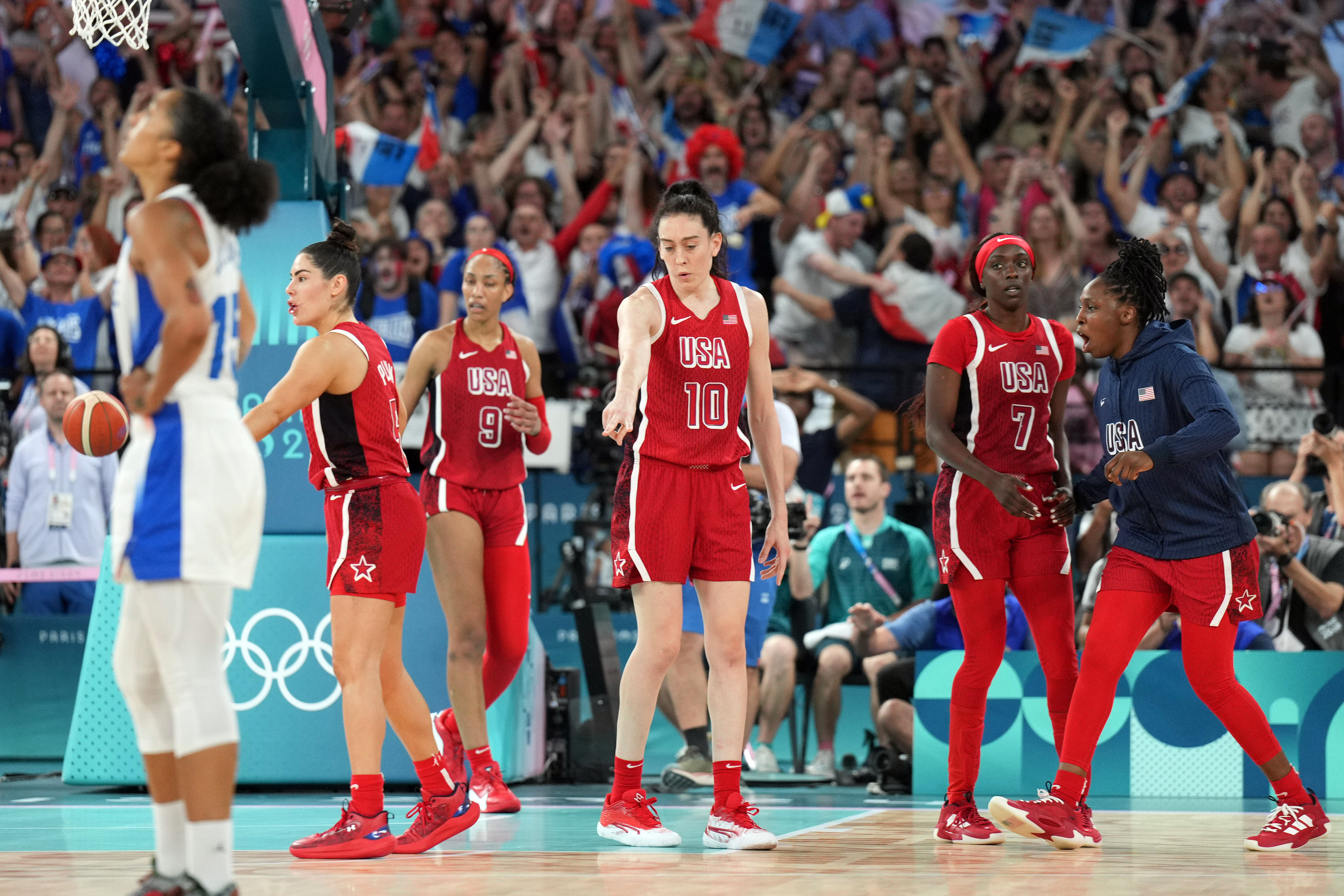 USA women&#039;s national team forward Breanna Stewart points at the three point line during the Paris 2024 Olympic Summer Games. Photo Credit: Imagn