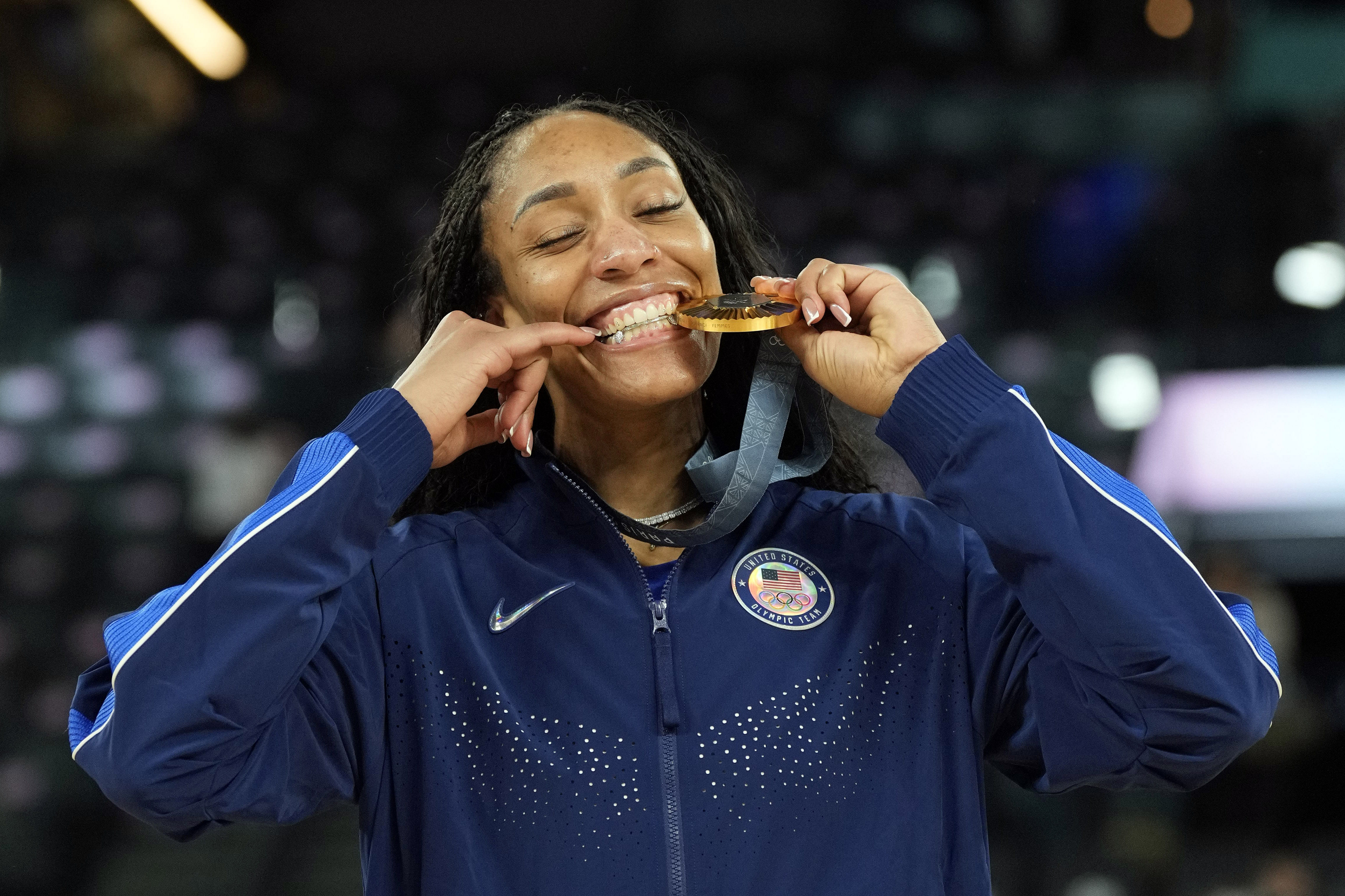 United States forward A&#039;ja Wilson celebrates with the gold medal at the Paris 2024 Olympic Summer Games. Photo Credit: Imagn