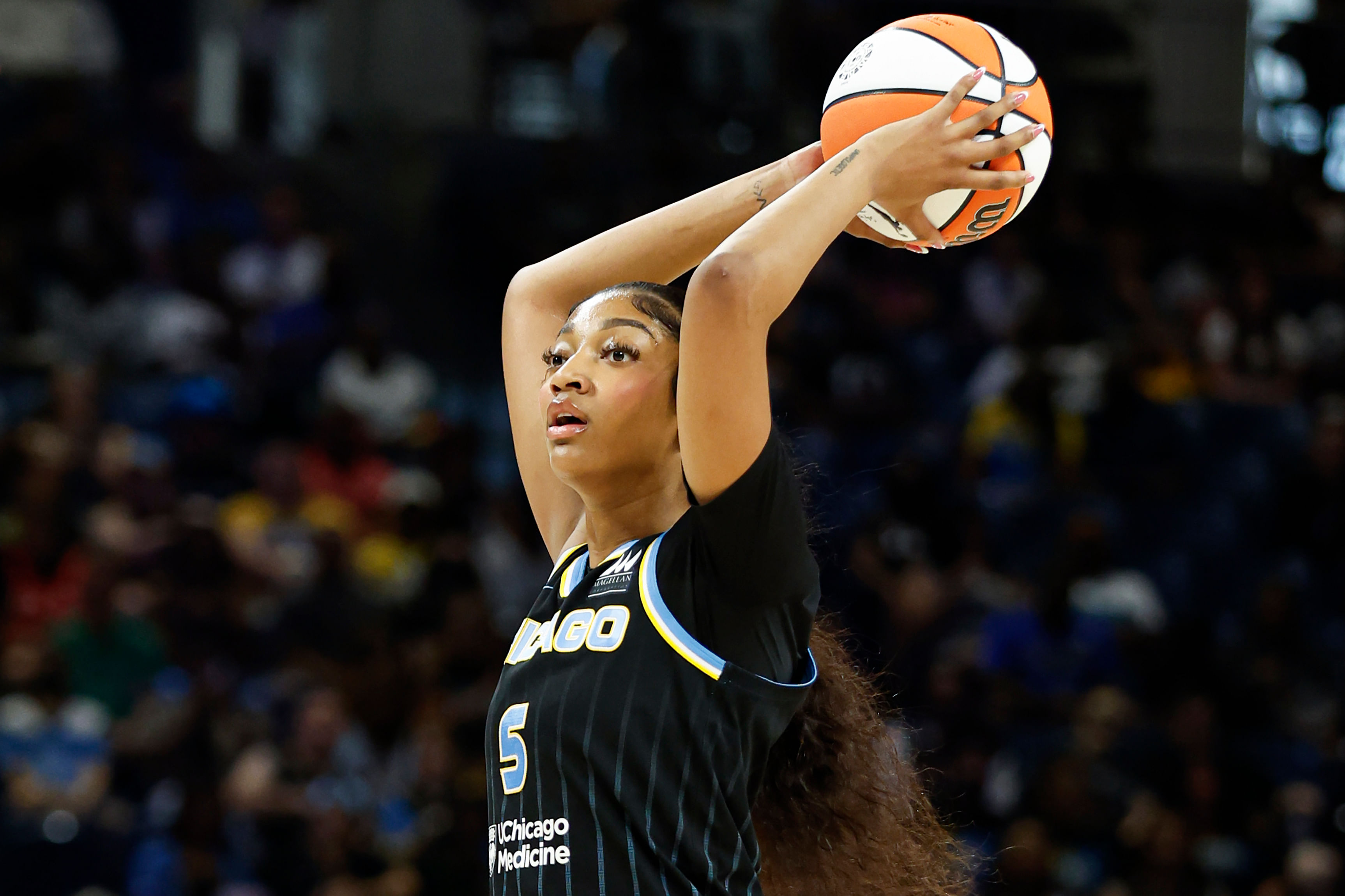 Chicago Sky forward Angel Reese looks to pass the ball against the Las Vegas Aces at Wintrust Arena. Photo Credit: Imagn