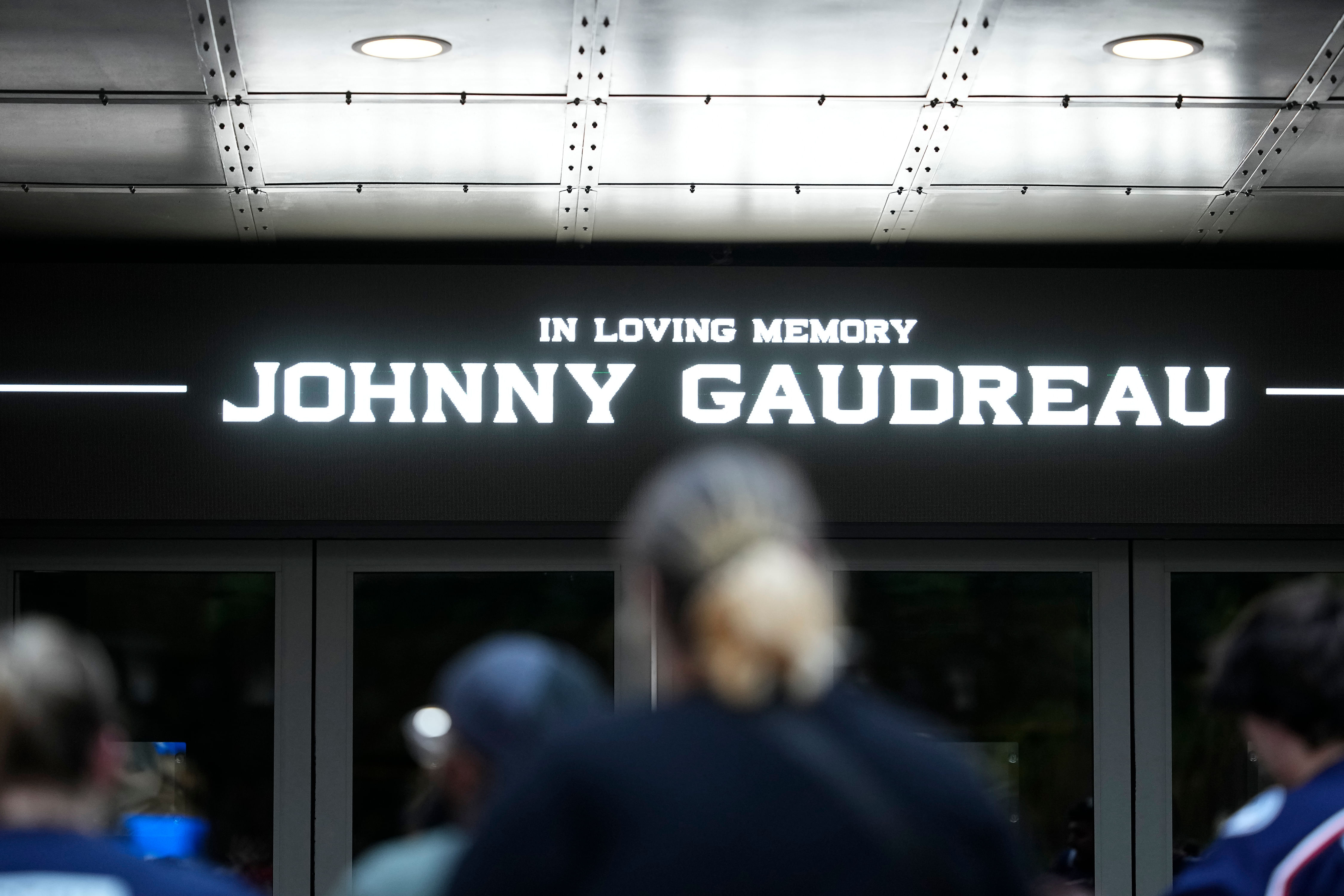 Mourners gather outside Nationwide Arena at a memorial for Johnny Gaudreau. (Source: Imagn)