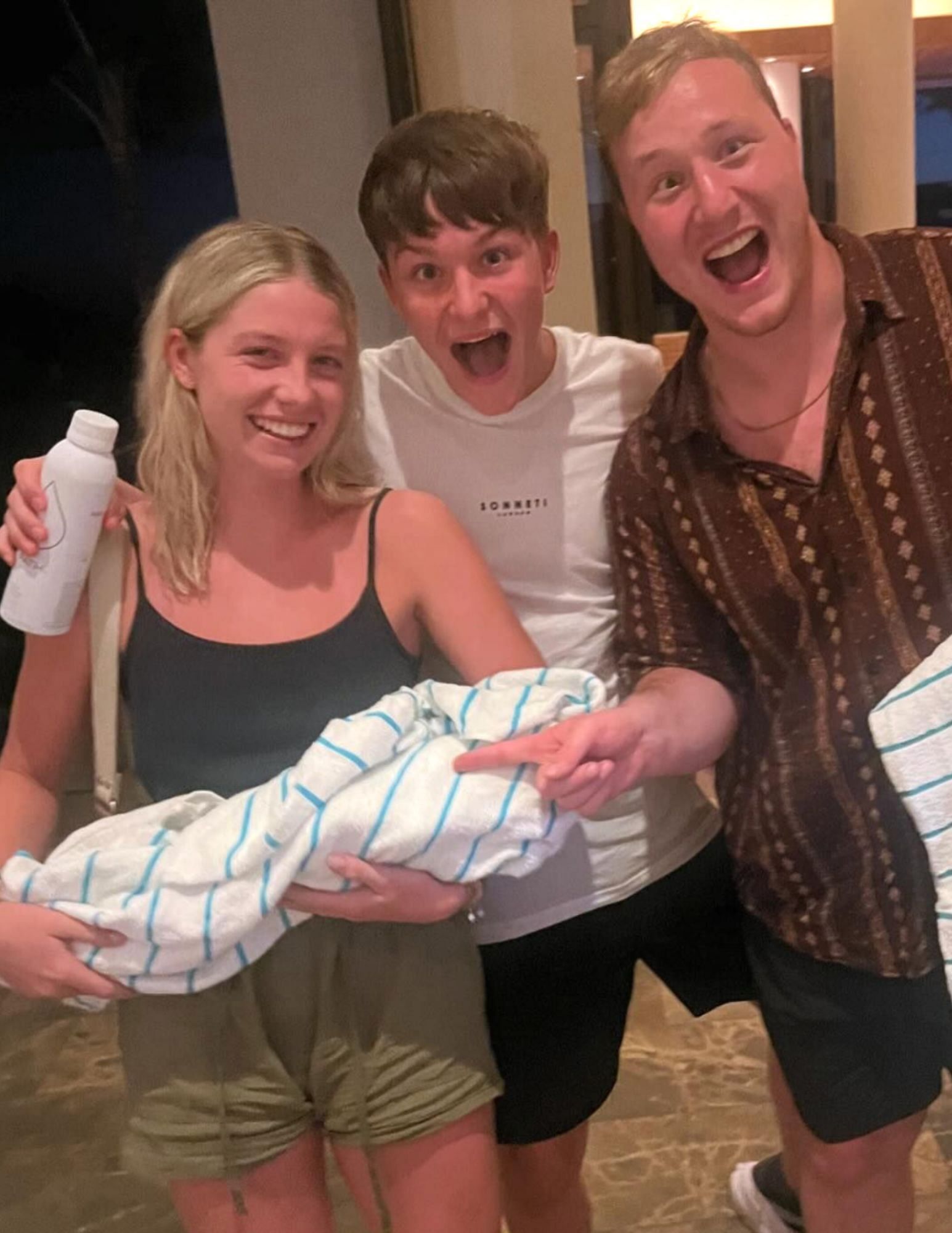 Ellie (left), Lucas (center) and Callum Bisping (right) joking that the Awapuhi plant is a &quot;baby.&quot; [Image courtesy: @mikebisping on Instagram]