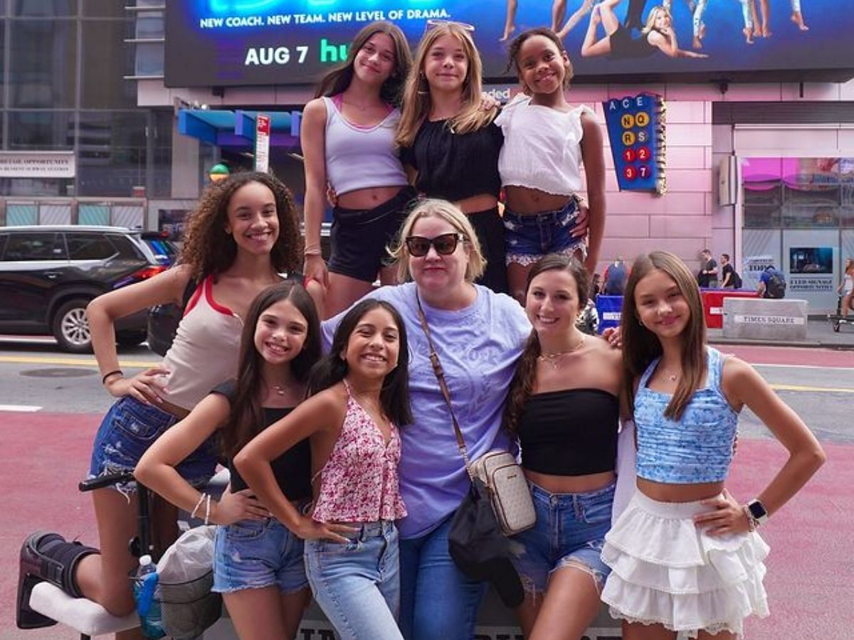 Cast of Dance Moms: New Era posing in front of their very own Billboard at Times Square (Image via Instagram/@leilahdancegirl)