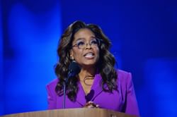 "Taking a page from Wendy Williams’ cameraman" — Internet reacts to camera showing random woman during Oprah's “childless cat lady” comment at DNC