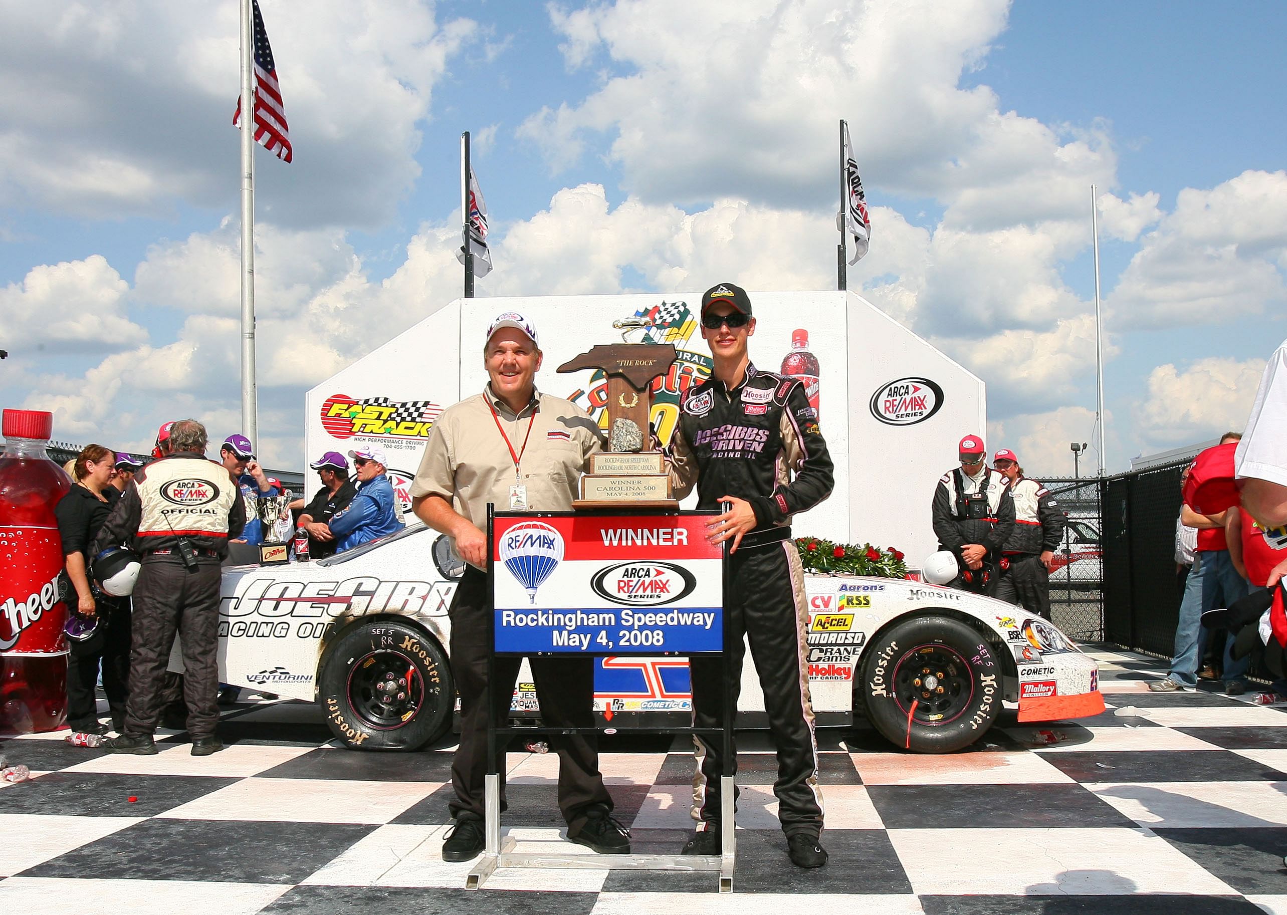 18-year-old ARCA RE/MAX Series driver Joey Logano celebrates after winning the Carolina 500 at the Rockingham Speedway in 2008 (Source: Imagn)