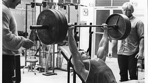 Why did Arnold Schwarzenegger use a suicide grip on bench press?