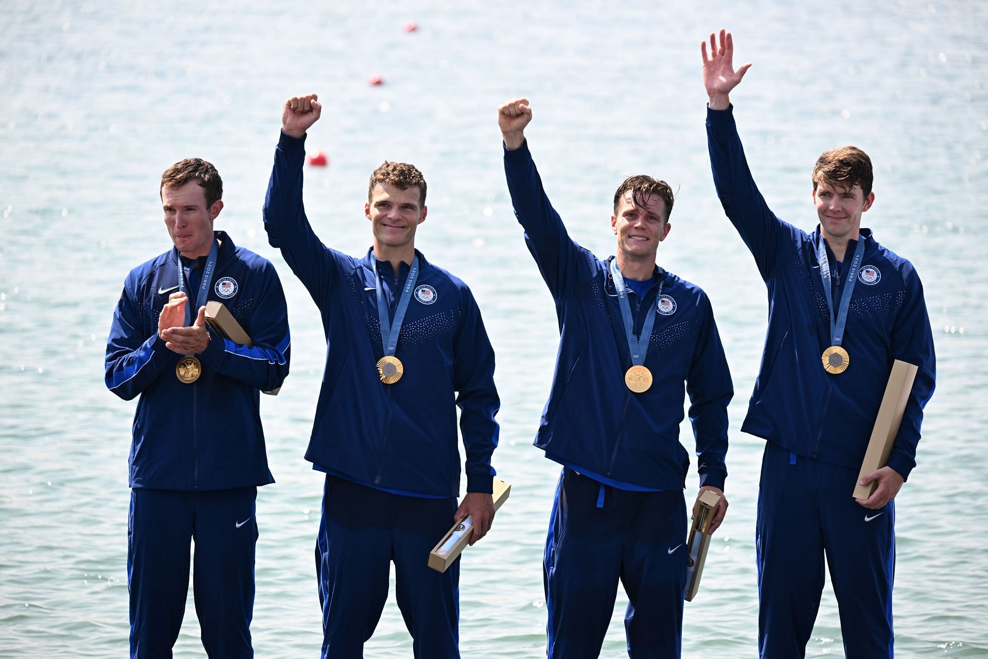 Nick Mead, Justin Best, Michael Grady and Liam Corrigan from the USA celebrate with their gold medals at the 2024 Paris Olympics (Picture: Getty)