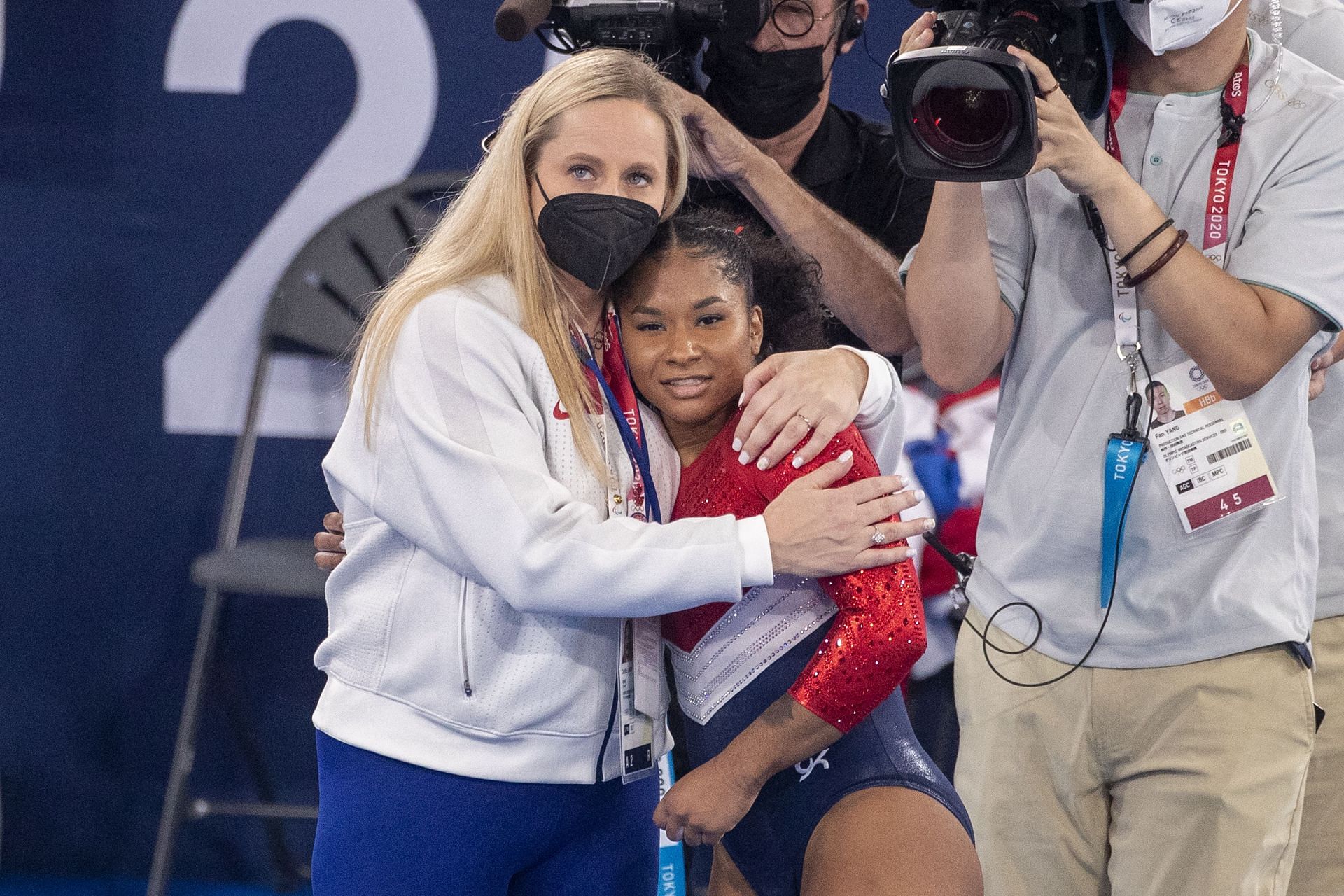 Cecile Landi embracing Jordan Chiles after her routine at the Team All Around Finals at the Tokyo Olympics [Image Source: Getty]