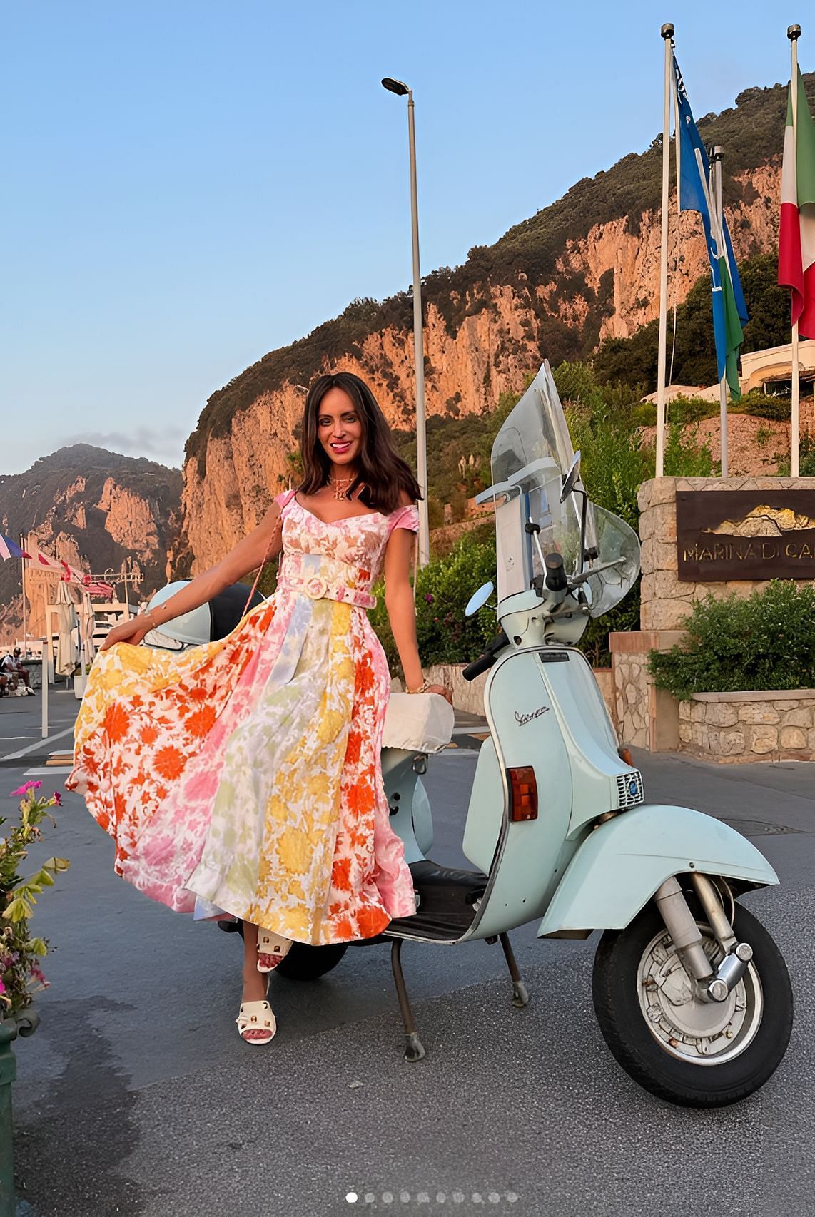 Samantha Busch in a Zimmermann Postcard Spliced Midi dress and Scholl Iconic Pescura Brooke sandals (IMAGE: Instagram, Samantha Busch)