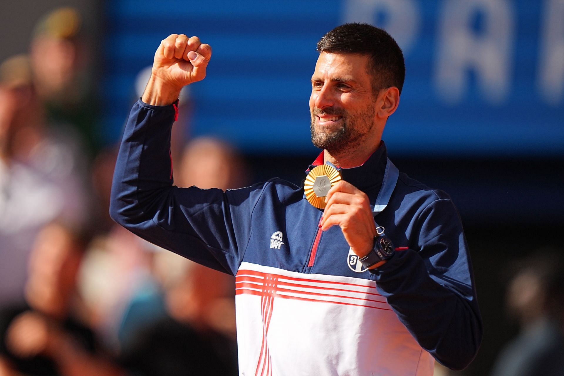 The Serb celebrates his gold medal (Image Source: Getty)