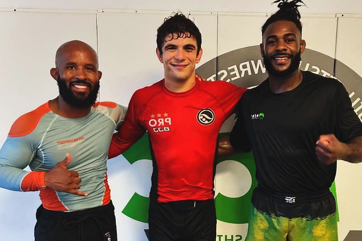 From left to right: Demetrious Johnson, Mikey Musumeci, and Aljamain Sterling.