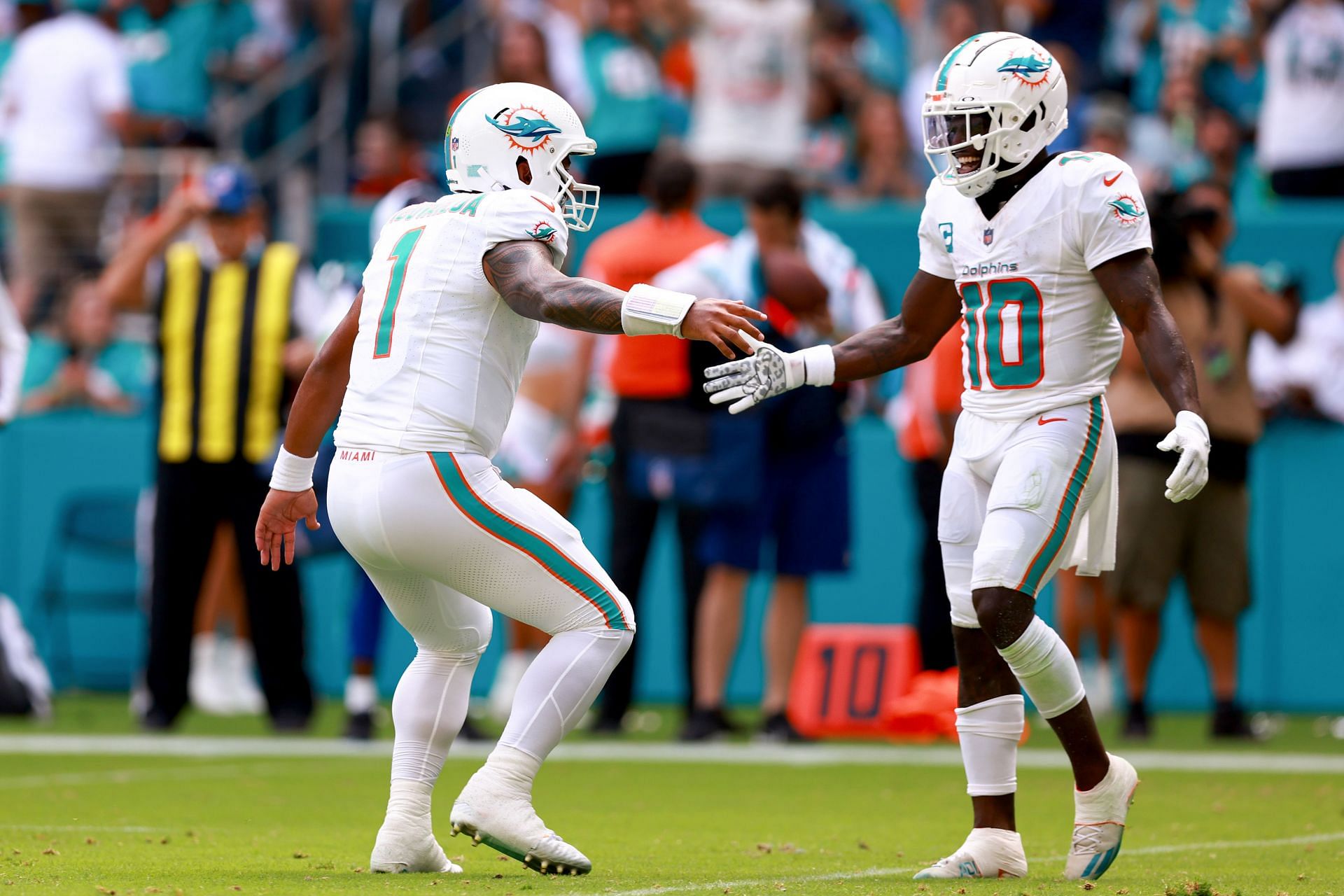 Tua Tagovailoa, left, and Tyreek Hill, right during Denver Broncos v Miami Dolphins - Source: Getty