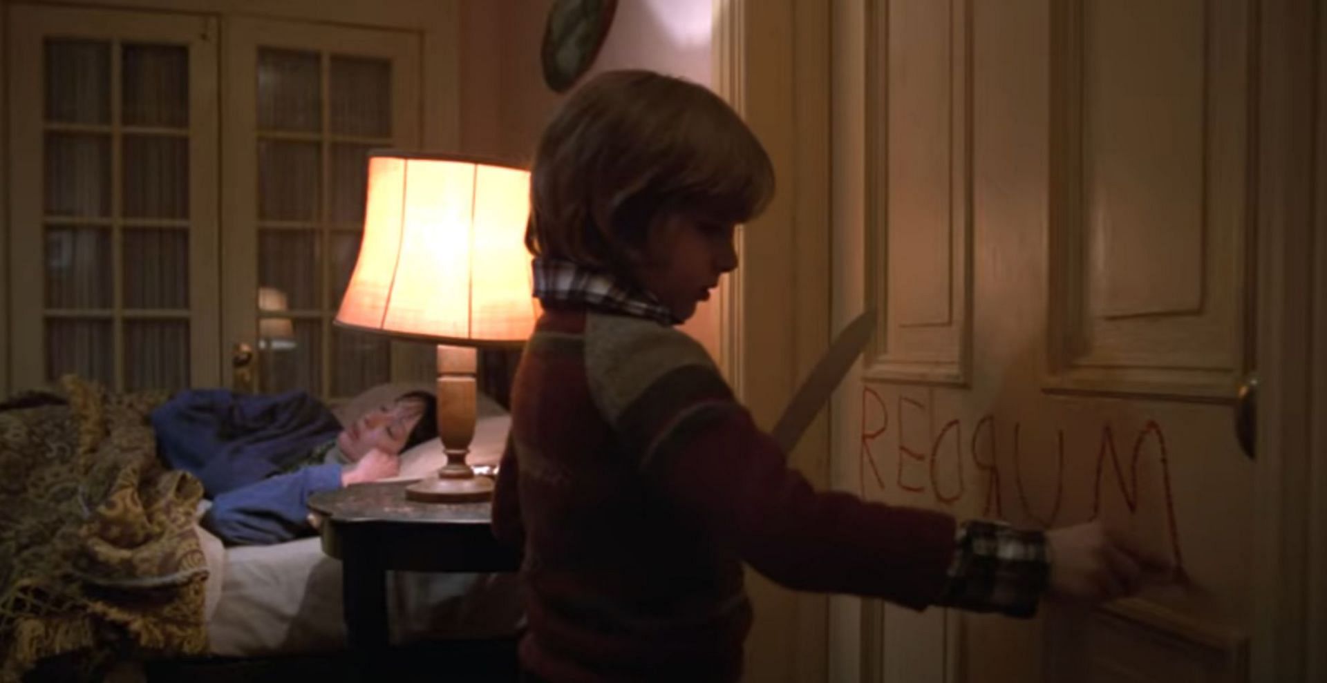 The elevator blood and REDRUM explained (Image via Warner Bros. Entertainment)