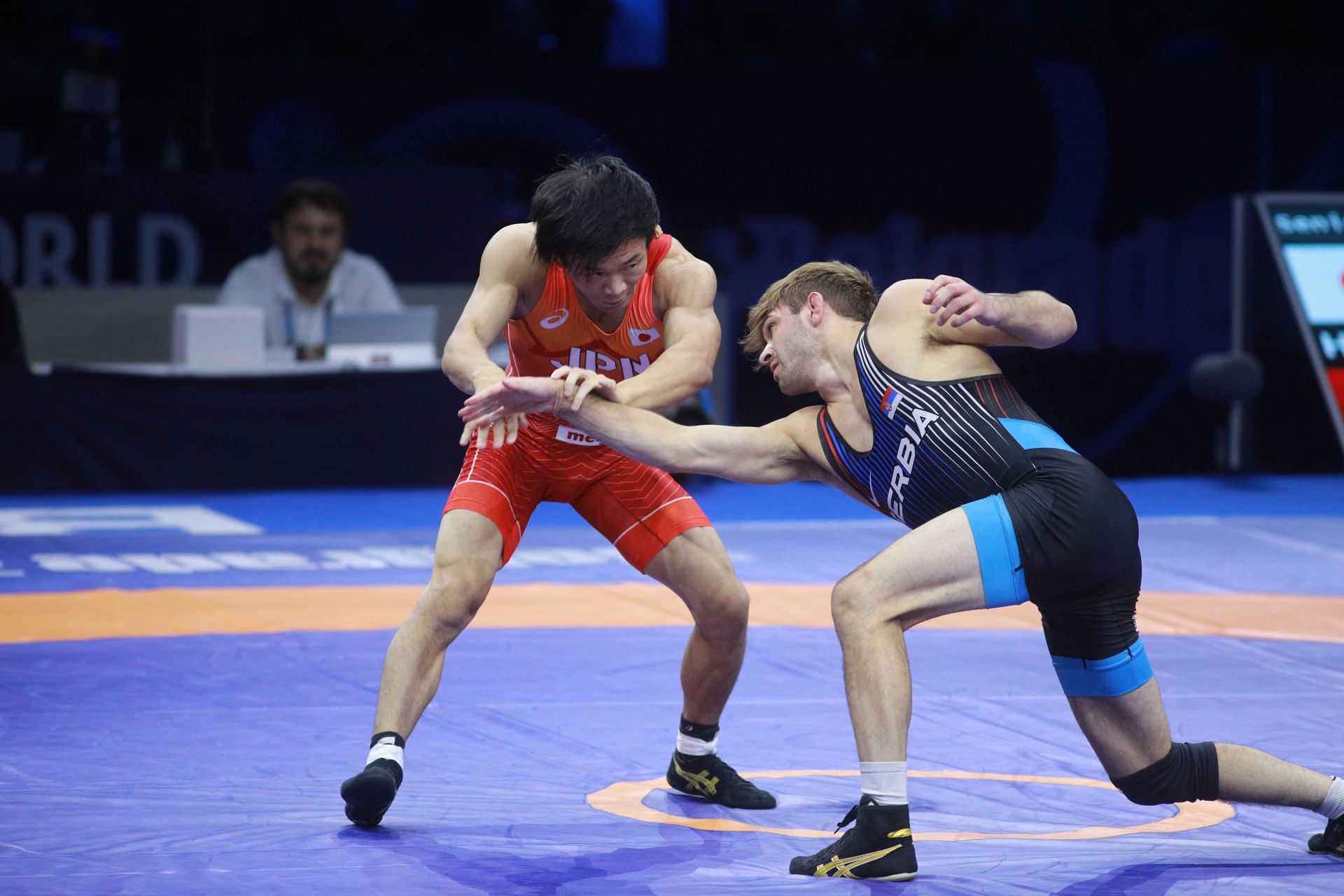 Rei Higuchi of Japan (L) against Stevan Micic during the finals of the 2023 World Wrestling Championships - Getty Images