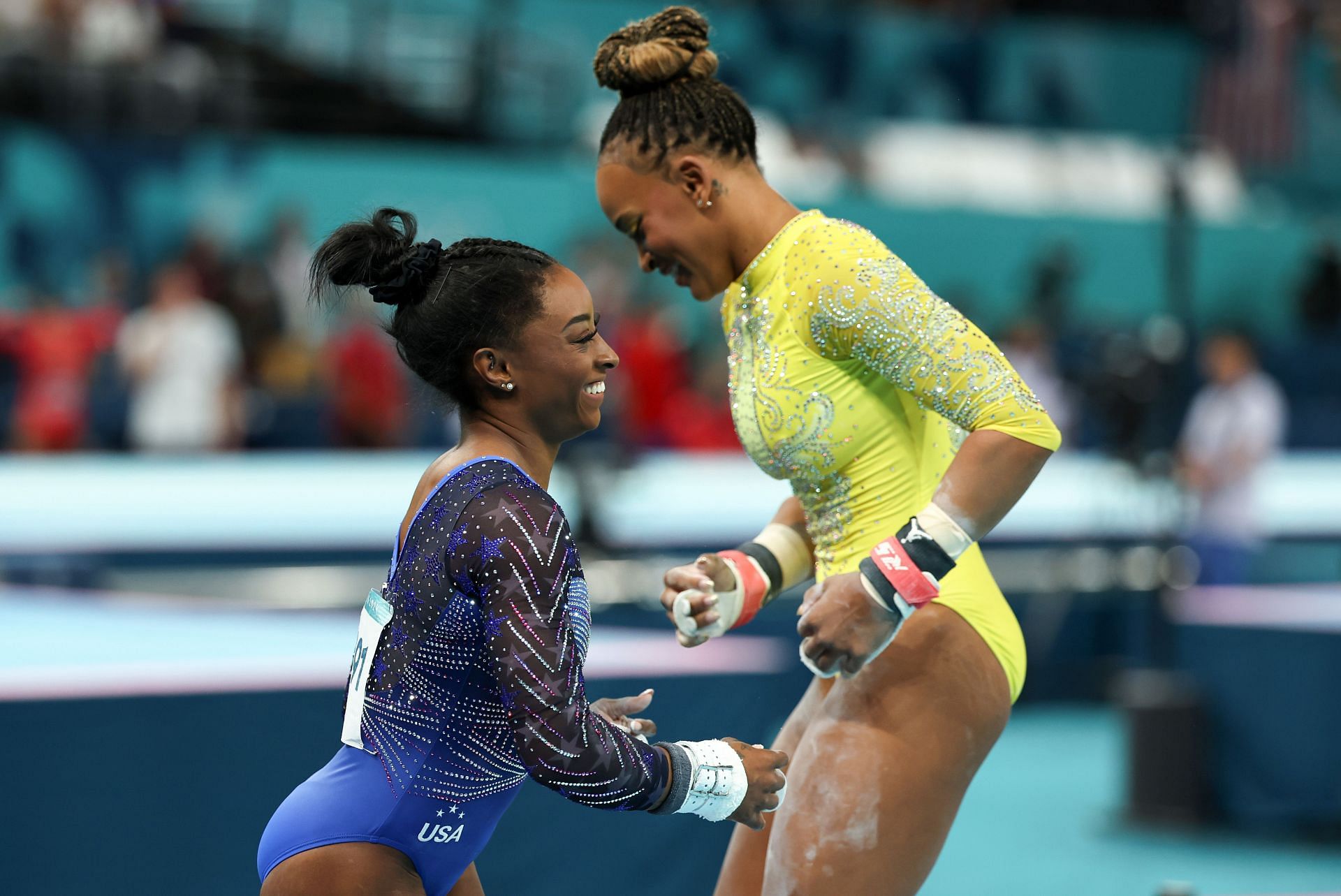 Simone Biles with Rebeca Andrade competes on the uneven bars during the women&#039;s Artistic Gymnastics All-Around Final at the Olympic Games 2024 in Paris, France. (Photo by Getty Images)