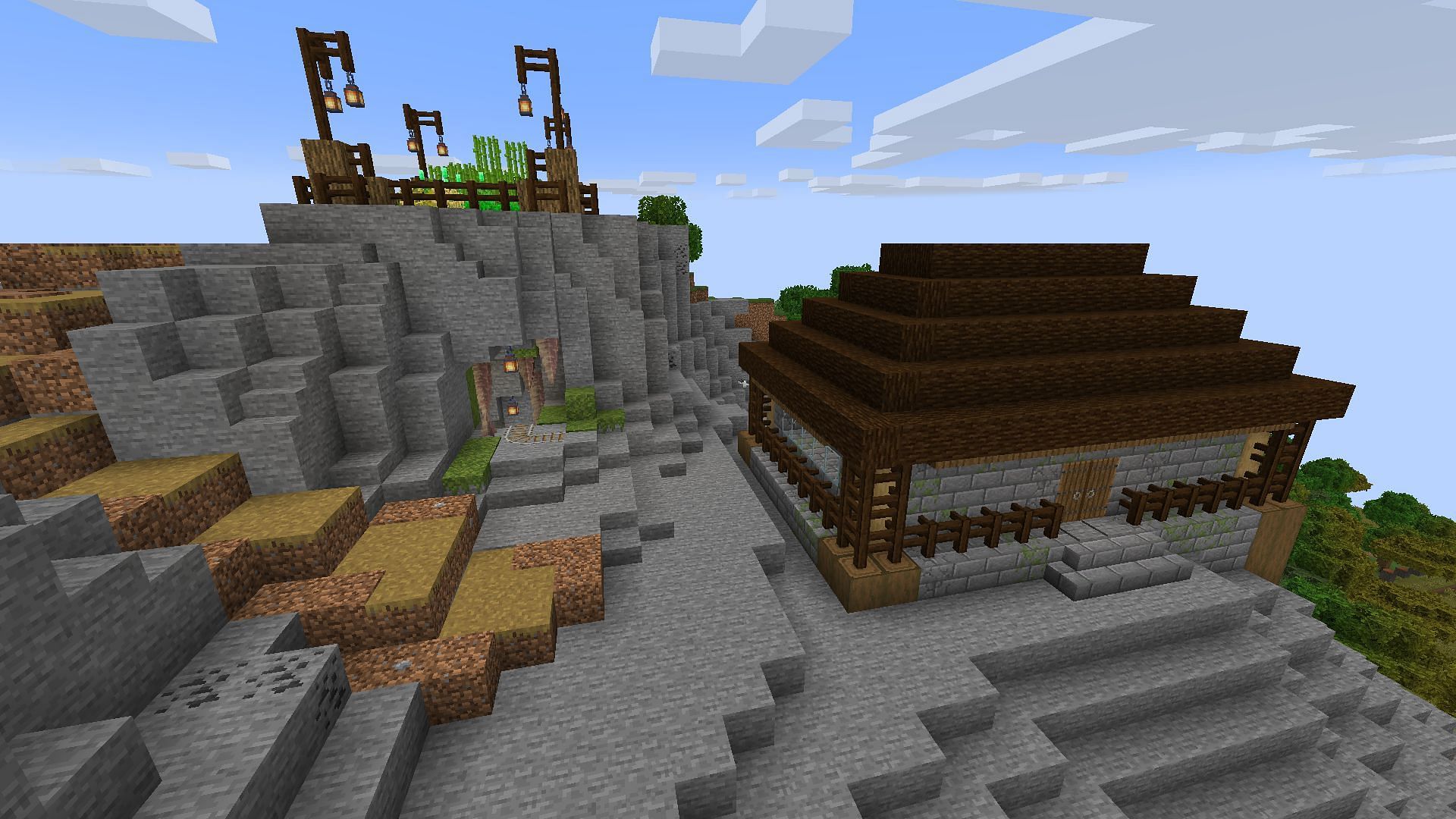 A simple Minecraft mountaintop base with a nearby starter farm and mine (Image via Mojang)