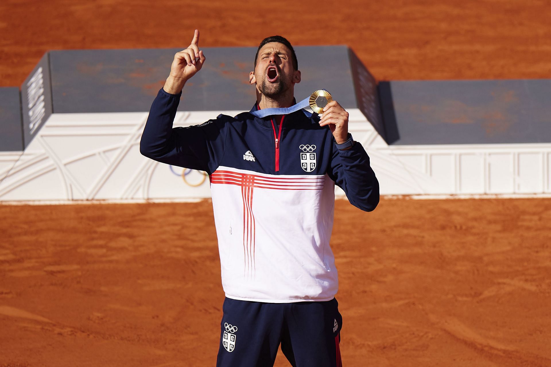 Novak Djokovic celebrates with the Olympic gold medal in Paris (Getty)