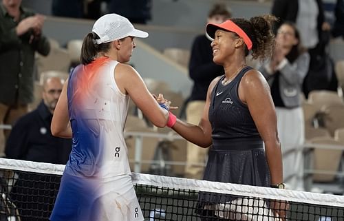 Iga Swiatek (L) and Naomi Osaka (R) shake hands after their second-round match at the 2024 French Open (Source: Getty)