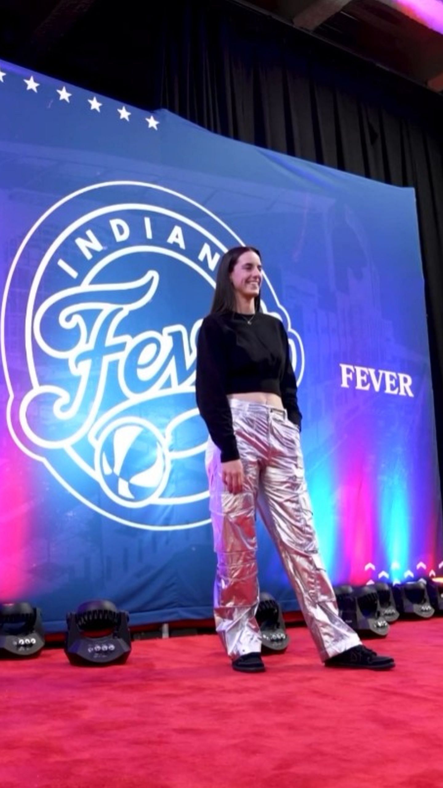 Clark puts on a pair of metallic grey pants for the Sun-Fever game / Image credit: @indianafever on IG