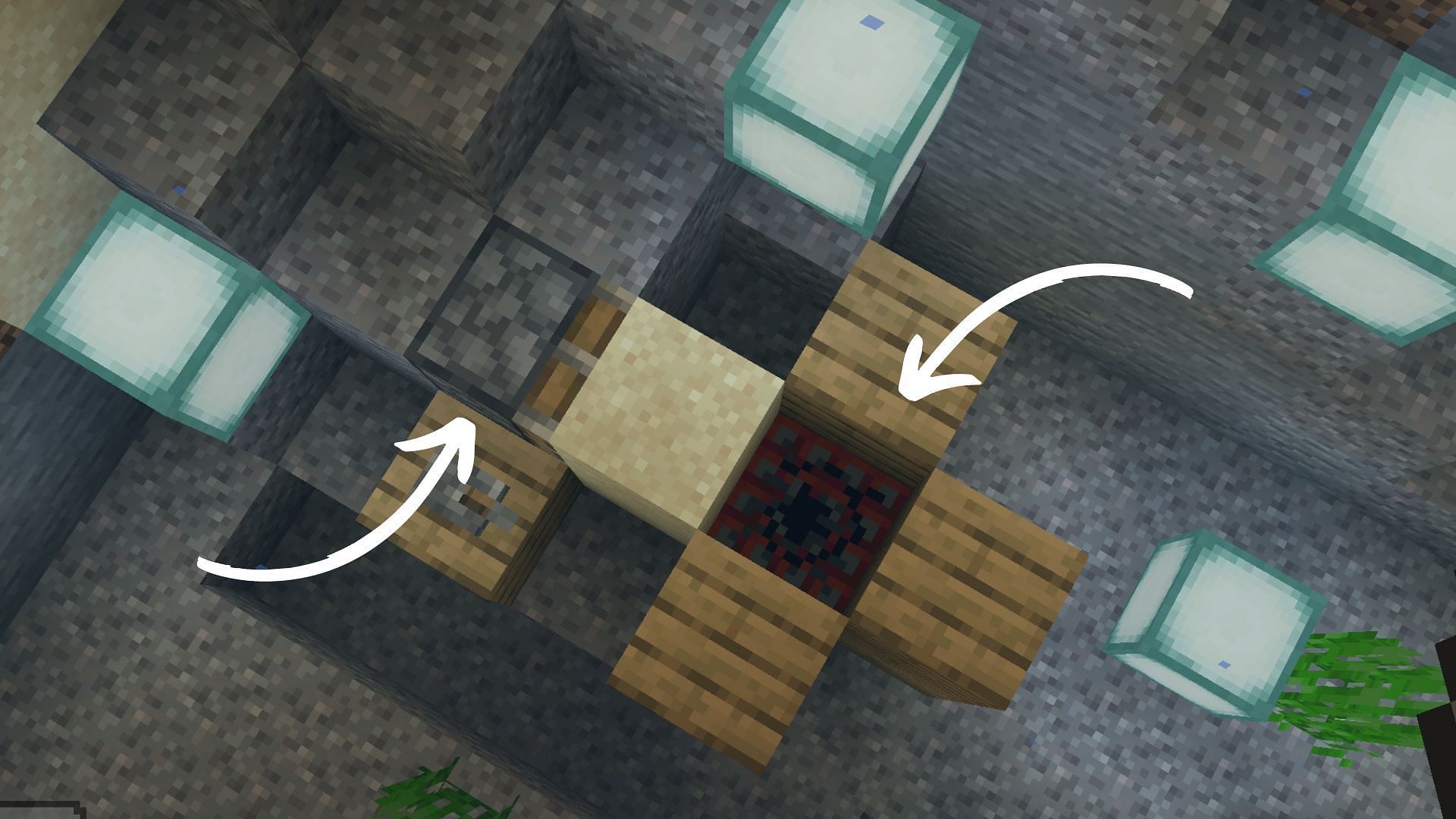 The piston pushes the sand block while the wood stops TNT from moving aside. (Image via Mojang Studios)