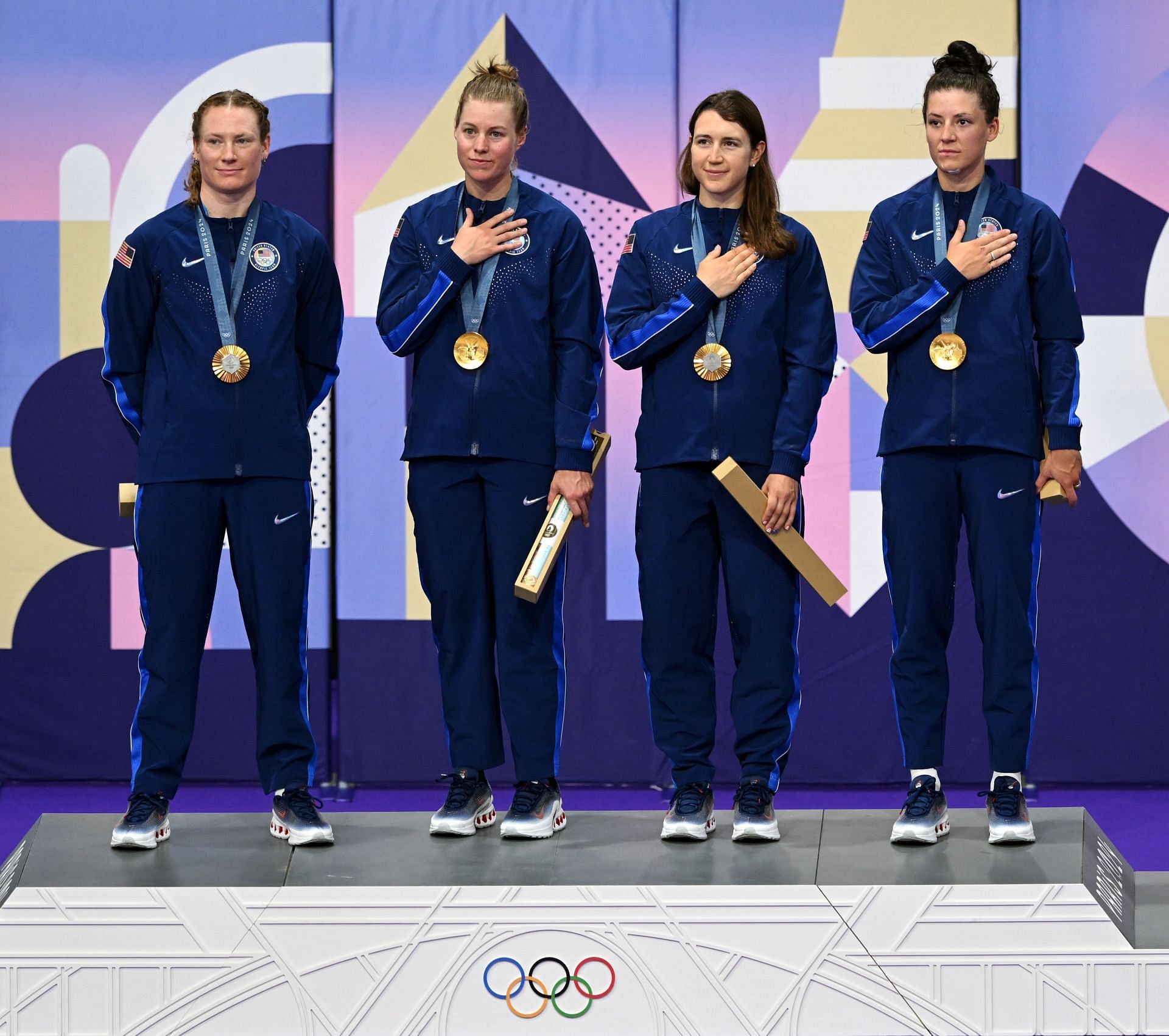 Jennifer Valente, Lily Williams, Chloe Dygert, and Kristen Faulkner of Team United States celebrate their gold medal at the 2024 Paris Olympics (Picture: Getty)