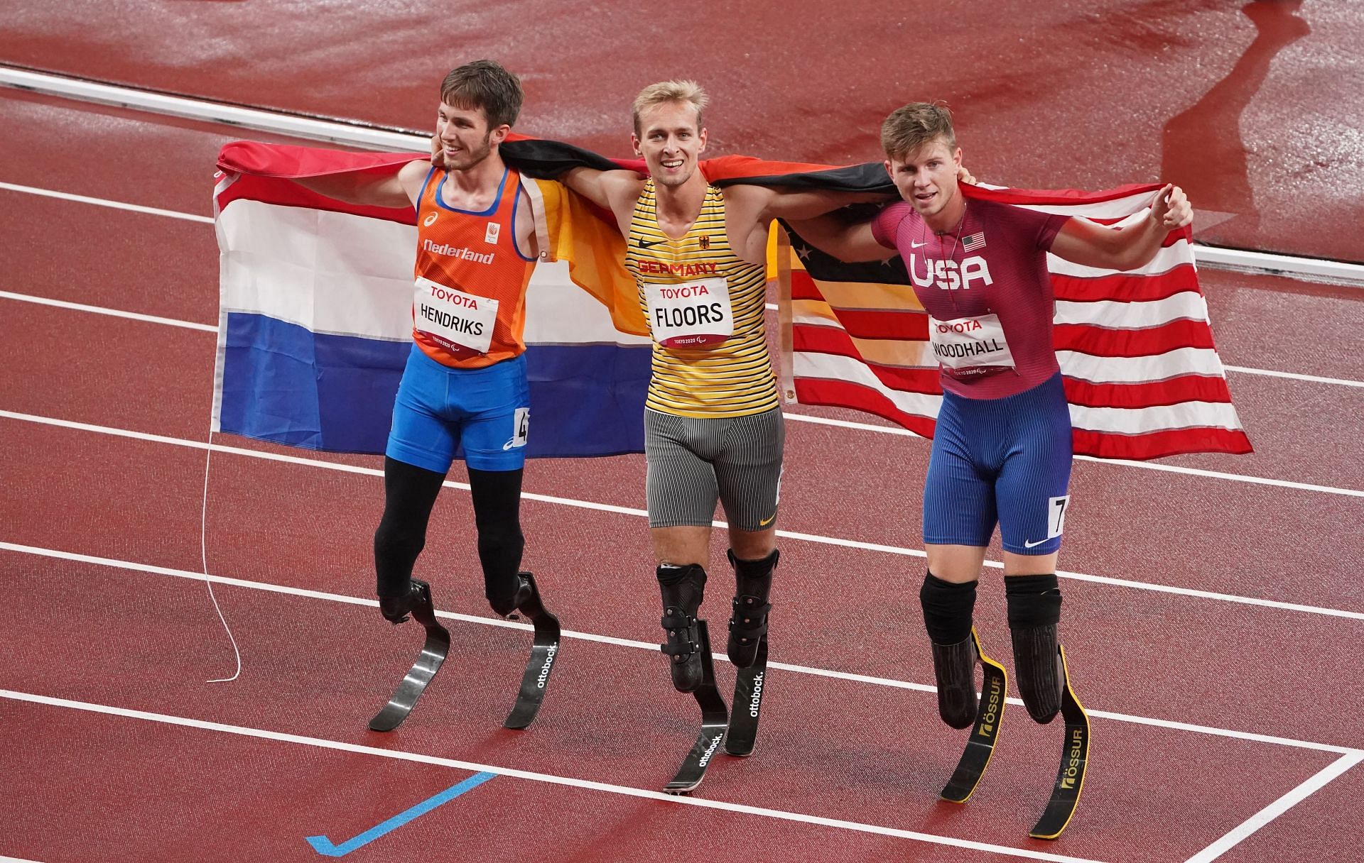 Johannes Floors (M), Olivier Hendriks (L), and Hunter Woodhall (R) at Tokyo Paralympics (Photo by Marcus Brandt/picture alliance via Getty Images)