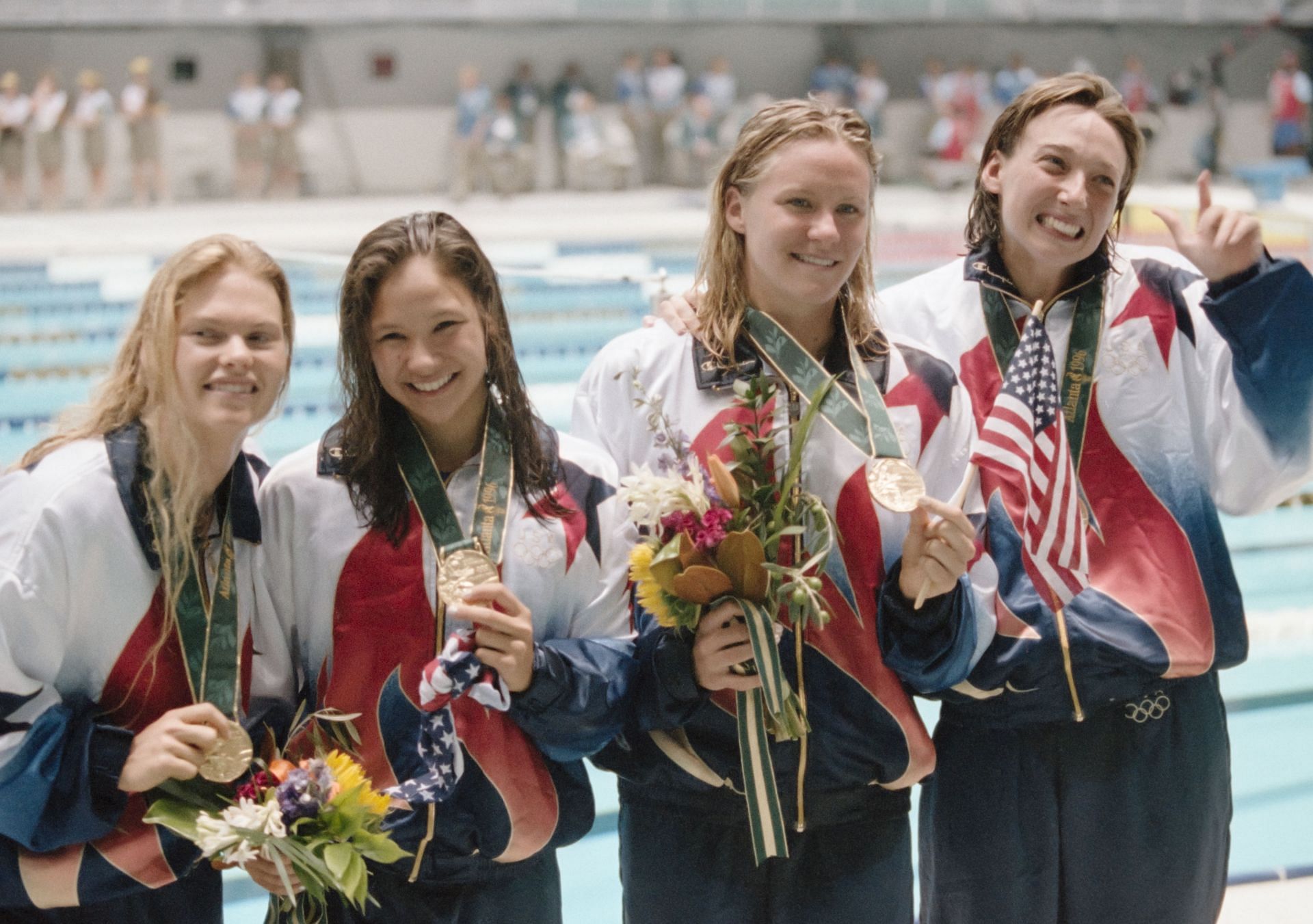 Jenny Thompson along with her teammates Angel Martino, Catherine Fox, and Amy Van Dyken celebrate their victory in the Women&#039;s 4x100 meter freestyle relay race during the 1996 Olympics in Atlanta, Georgia. (Photo by Getty Images)